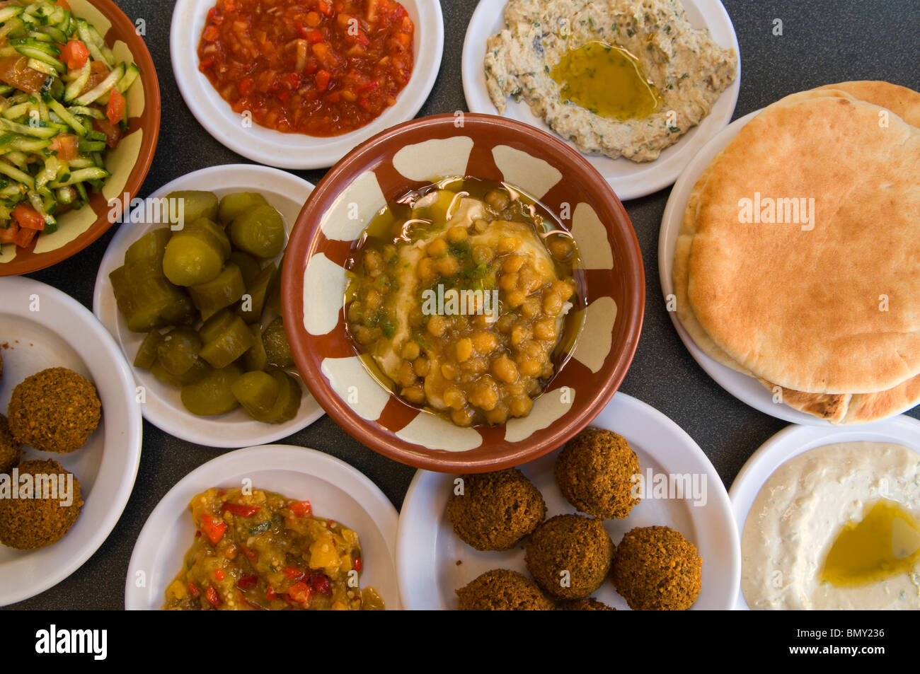 Plate of Hummus with Ful or Foul brown fava beans with all sort of