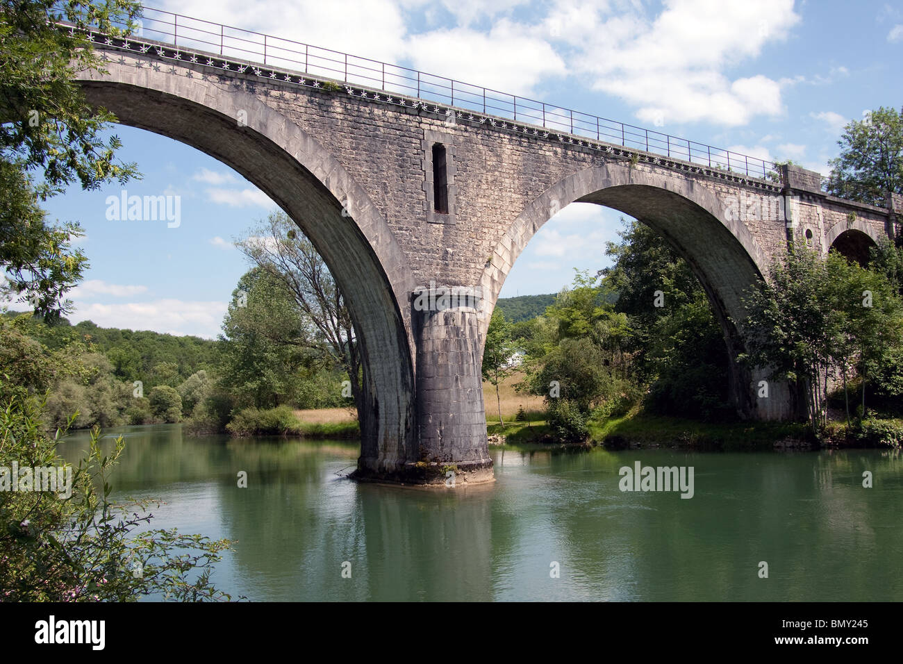 old road bridge river doubs trees arch village Stock Photo