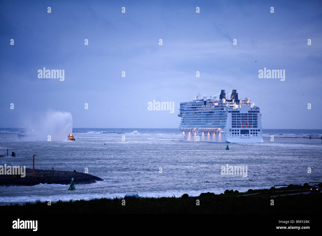 Cruise ship Norwegian Epic leaving the port of Rotterdam during dusk for her maiden trip to Southampton June 2010 Stock Photo