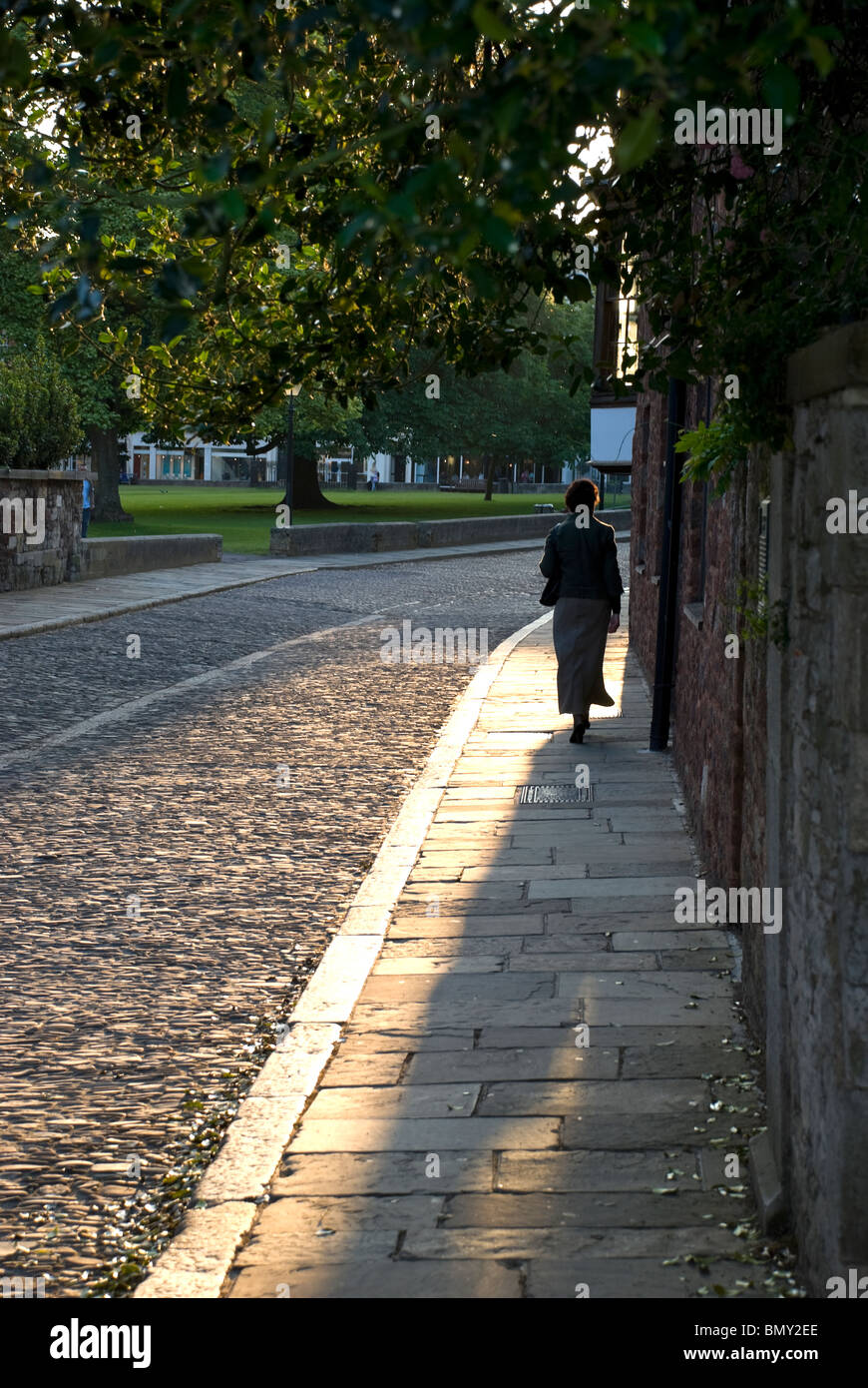 evening sunlight on stone pavement exeter cathedral close Stock Photo