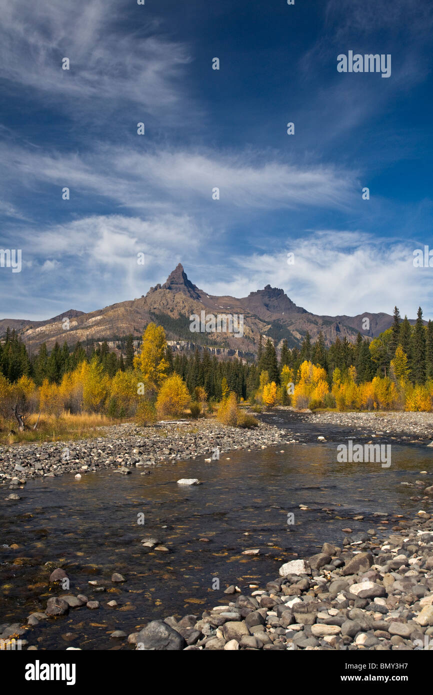 Shoshone National Forest, WY: View of Pilot Peak and from along the Clark's Fork River with fall colored cottonwoods Stock Photo