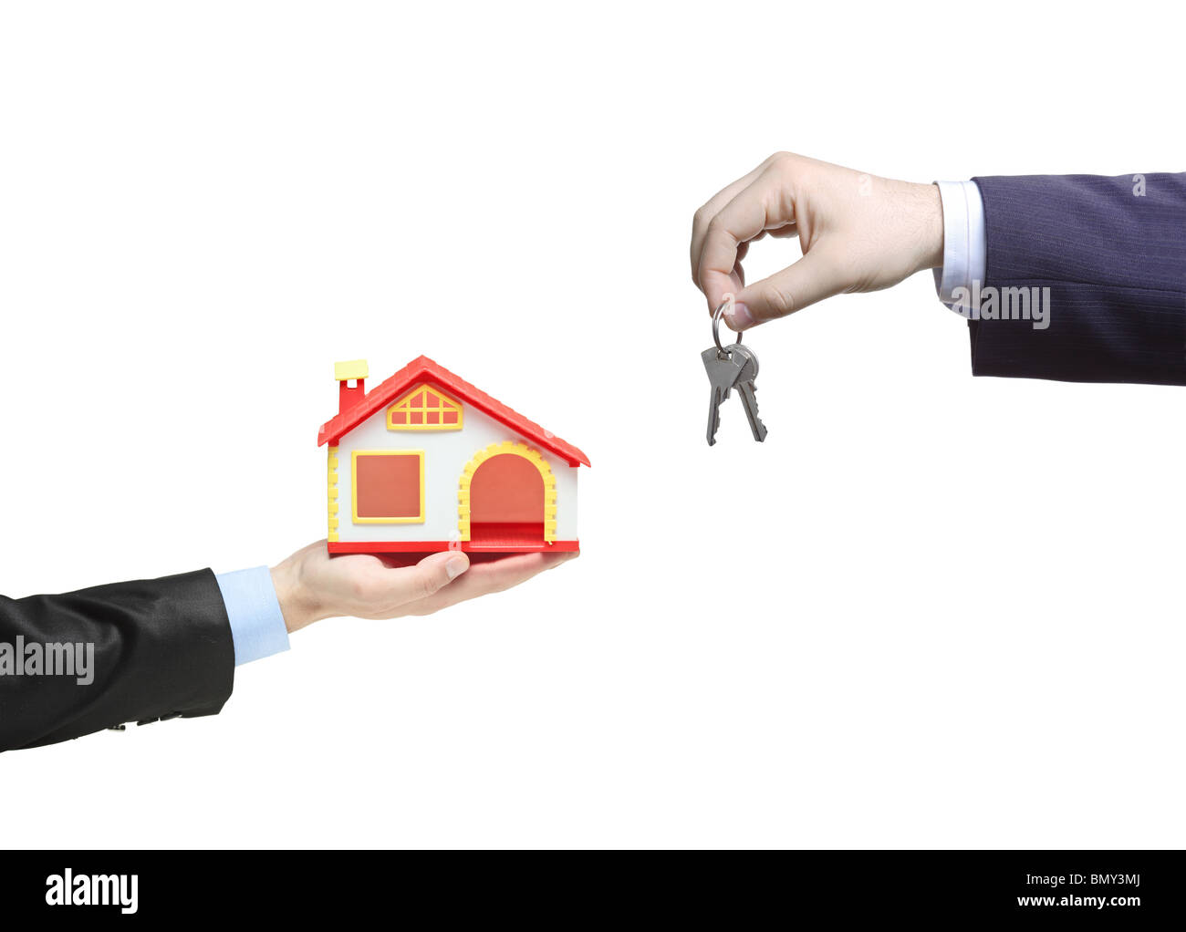 Real estate agent holding keys from your new home Stock Photo Alamy