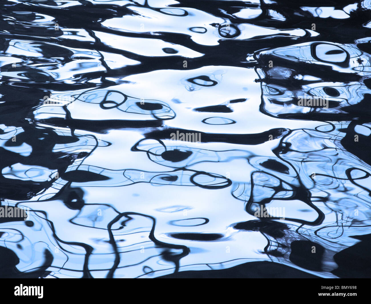 Abstract image created by reflections in blue water Stock Photo