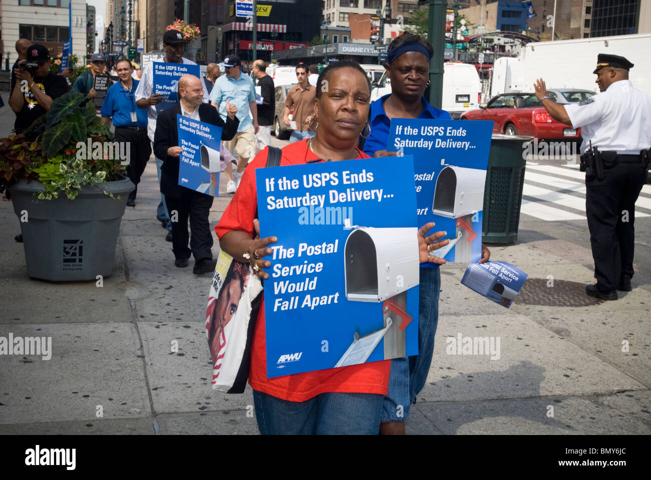 Postal workers rally in front of the James Farley Post Office in New