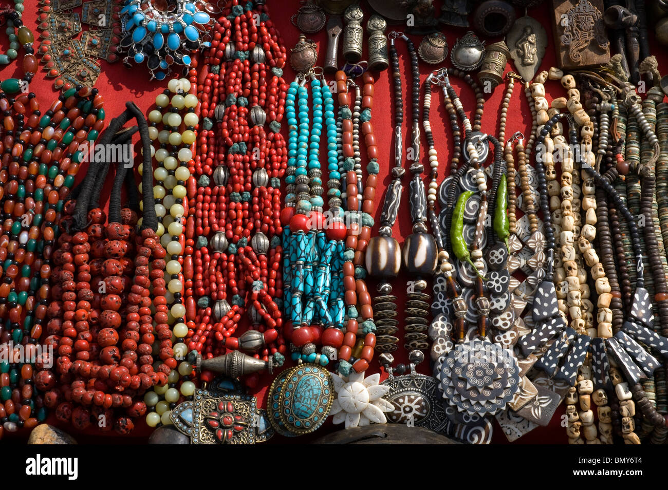 Necklaces and Mala beads of bone, shell, red coral, turquoise, and other materials, for sale in Durbar Square, Kathmandu, Nepal. Stock Photo