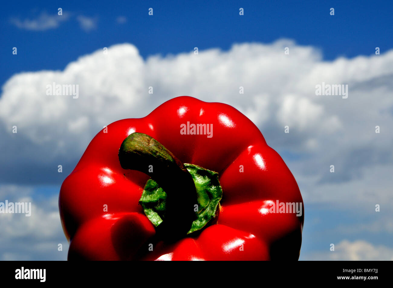 Red bell pepper, sky and clouds Stock Photo Alamy