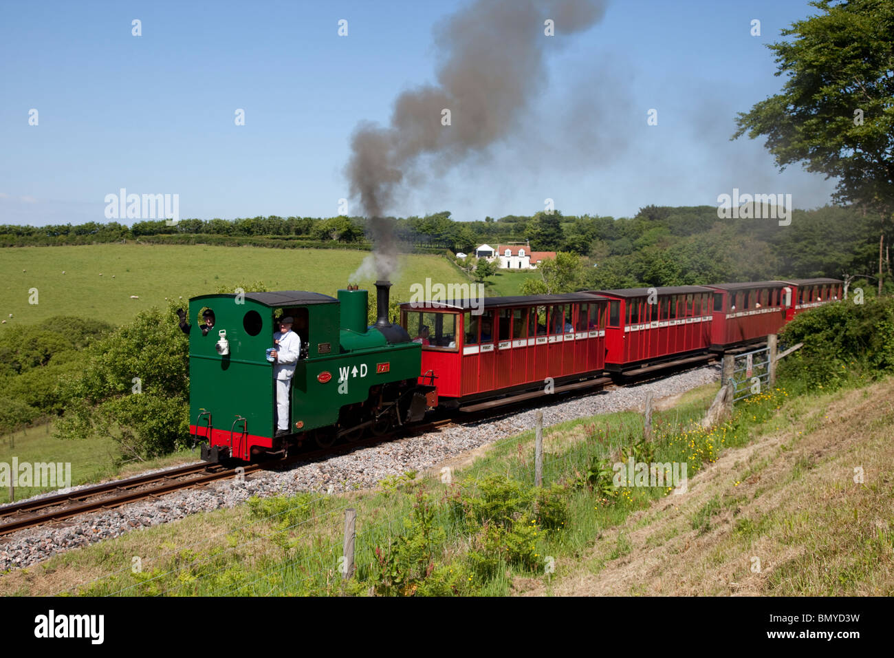 Steam train with red carriages Lynton & Barnstaple narrow gauge railway Woody Bay Station Parracombe Lynton North Devon UK Stock Photo