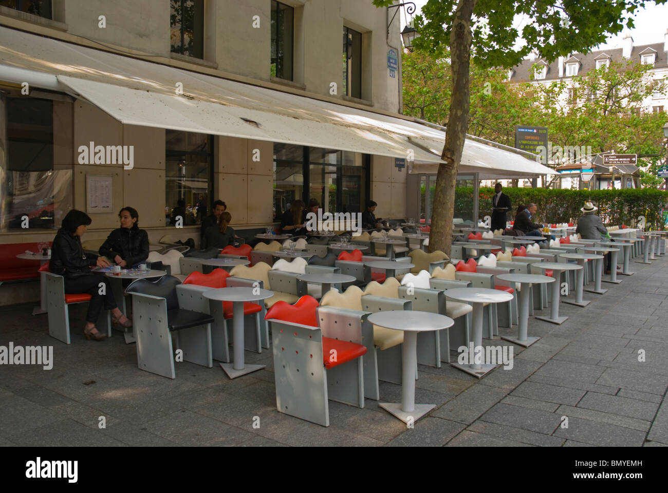 Cafe restaurant terraces Rue Saint Merri street Le Marais district central Paris France Europe Stock Photo