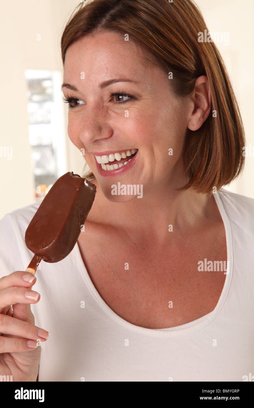 WOMAN EATING CHOCOLATE ICE CREAM BAR Stock Photo Alamy