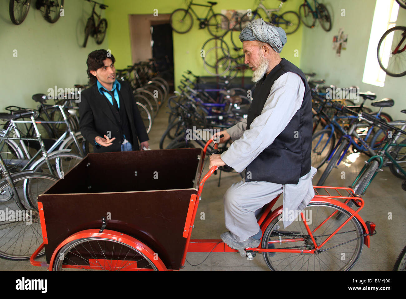 afghan afghani afghanistan afghans area bice bices bicycle bicycles bicyclet capital city daily life donation kabul man musli Stock Photo