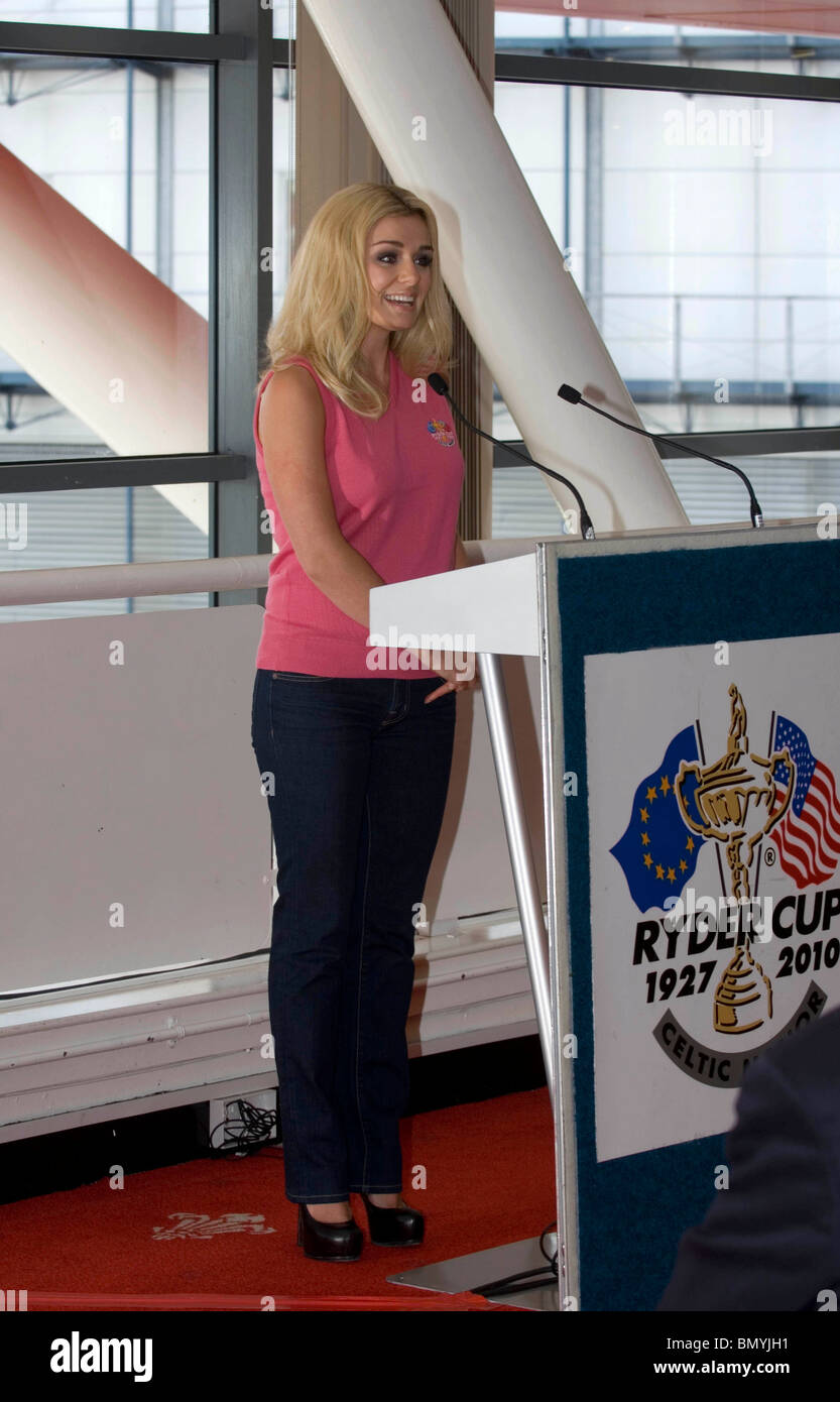The Welsh singer Katherine Jenkins poses with a golf club outside the Millennium Stadium in