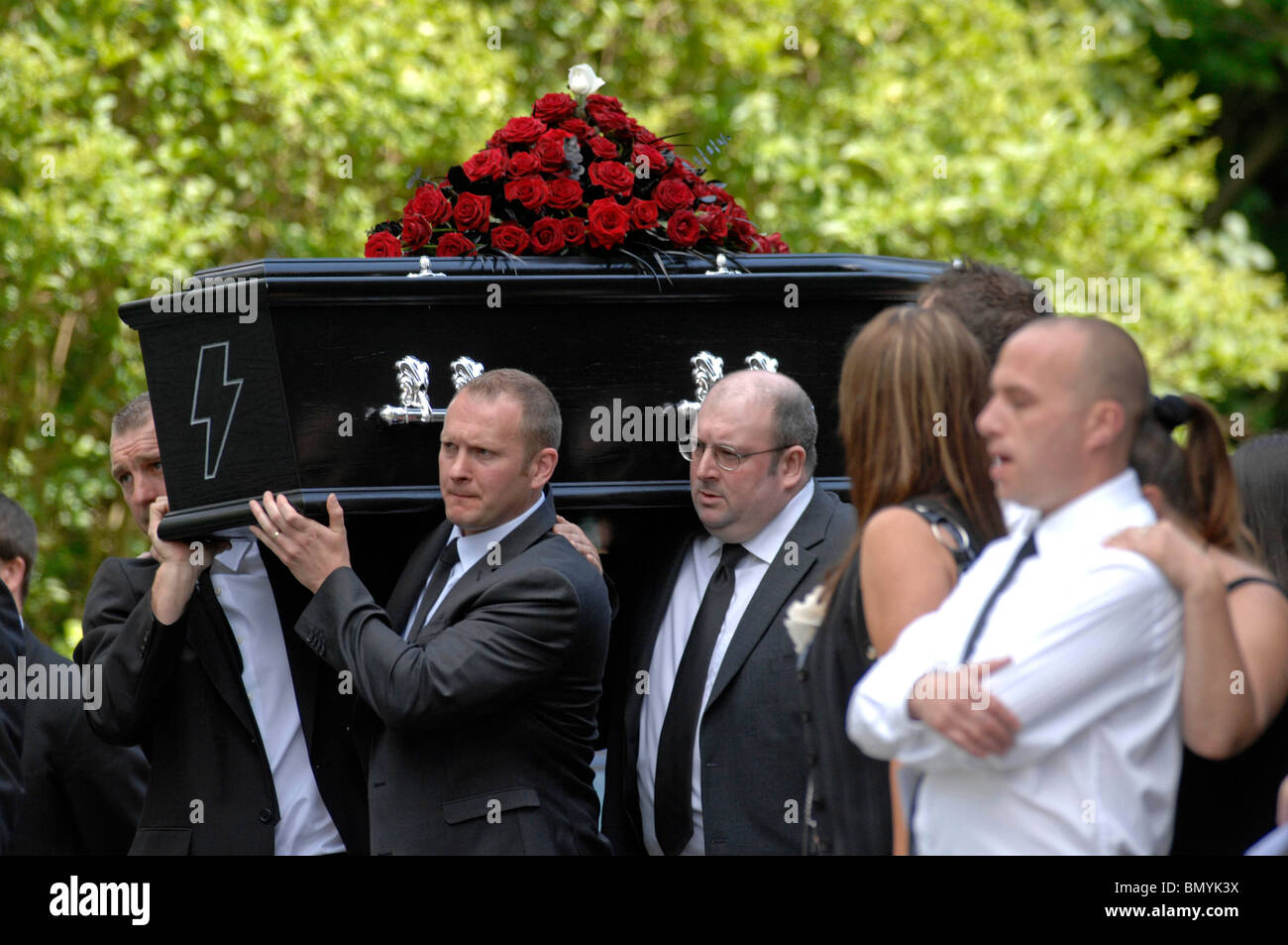 Coffin with black coffin had an AC/DC lightning motif on the front at ...