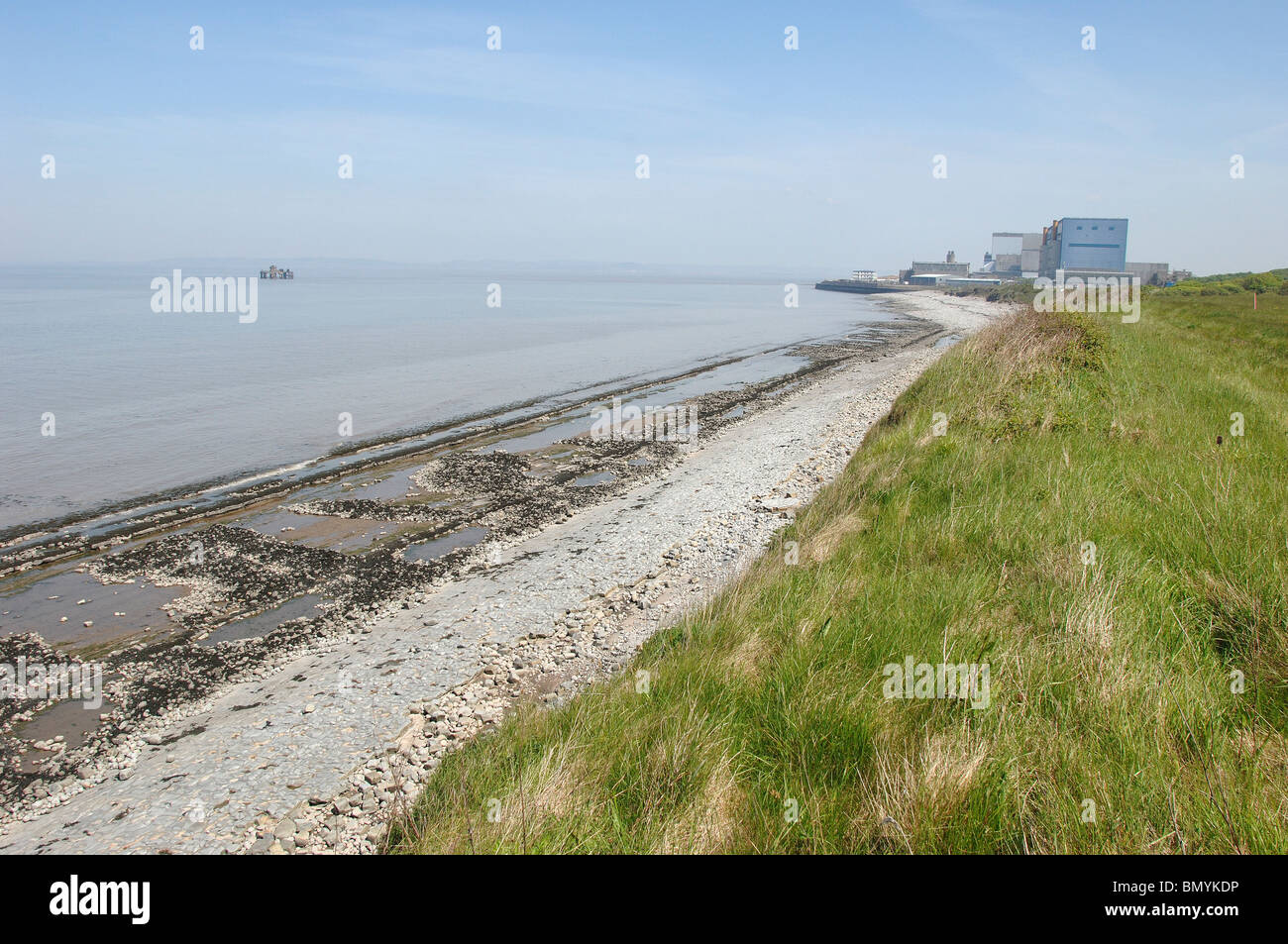 Beach where Proposed Hinkley C Nuclear Power station would be built with Existing Nuclear Stations behind Stock Photo