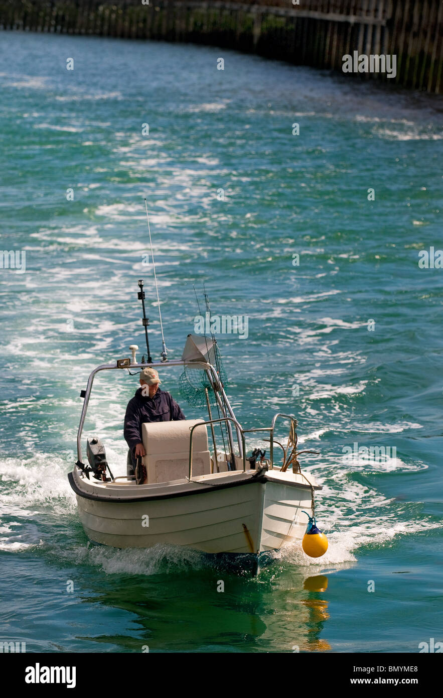 Dinghy person fisherman angler water portrait wake wp ph hires stock