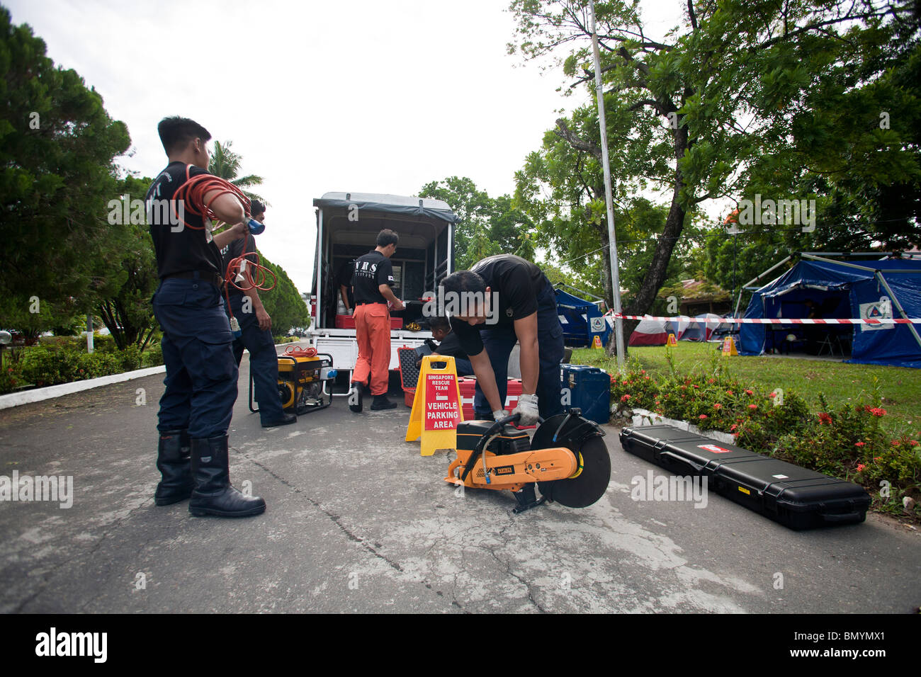 Rescue workers from Singapore prepare their equipment in Padang, Indonesia, Stock Photo