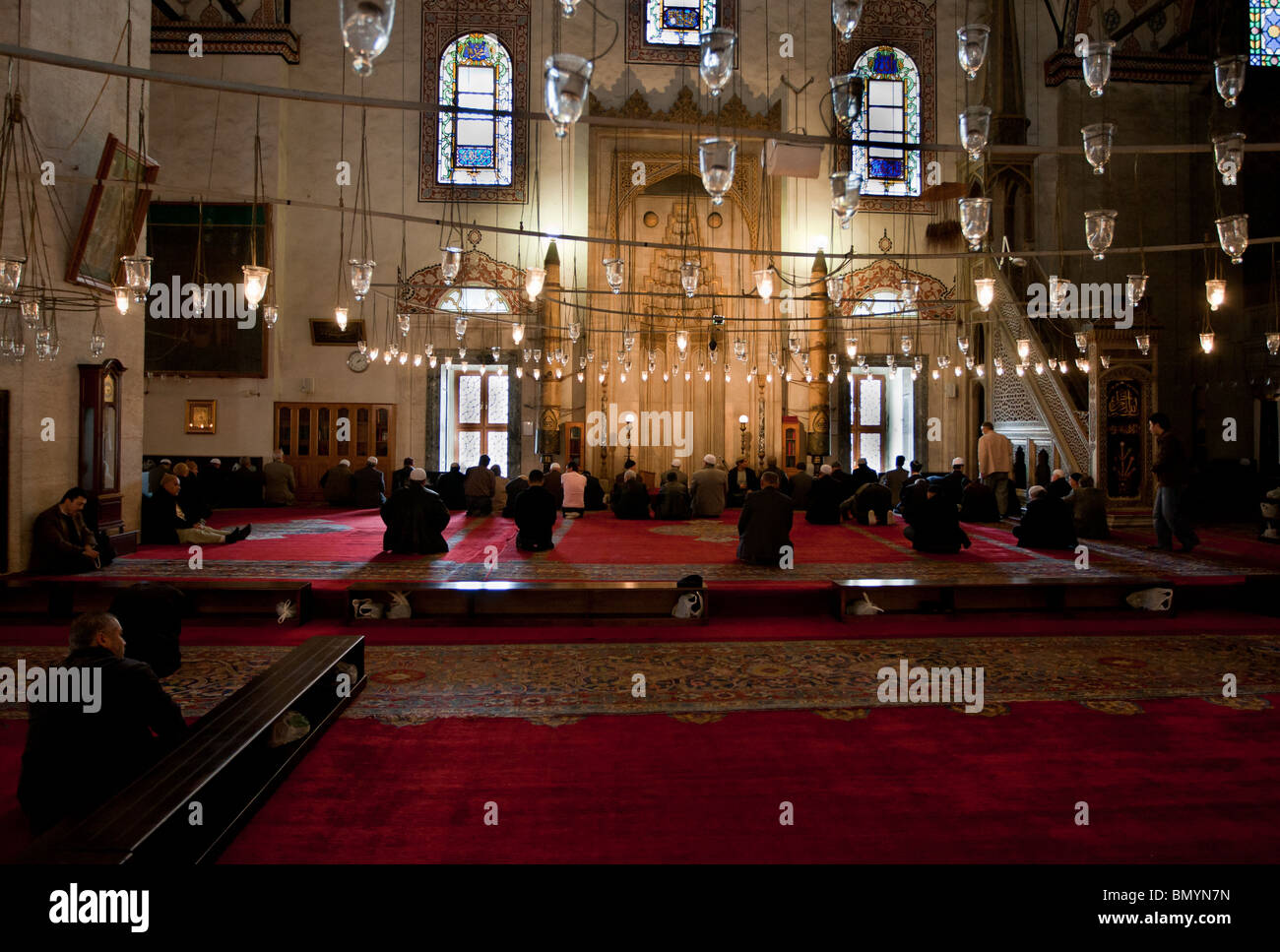 Muslims praying in Beyazit mosque, Istanbul, Turkey Stock Photo