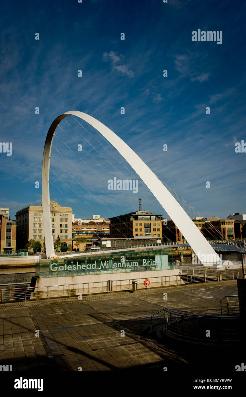 The Gateshead Millennium Bridge shot from the south bank of the river Tyne looking towards the Quayside area on the north bank. Stock Photo