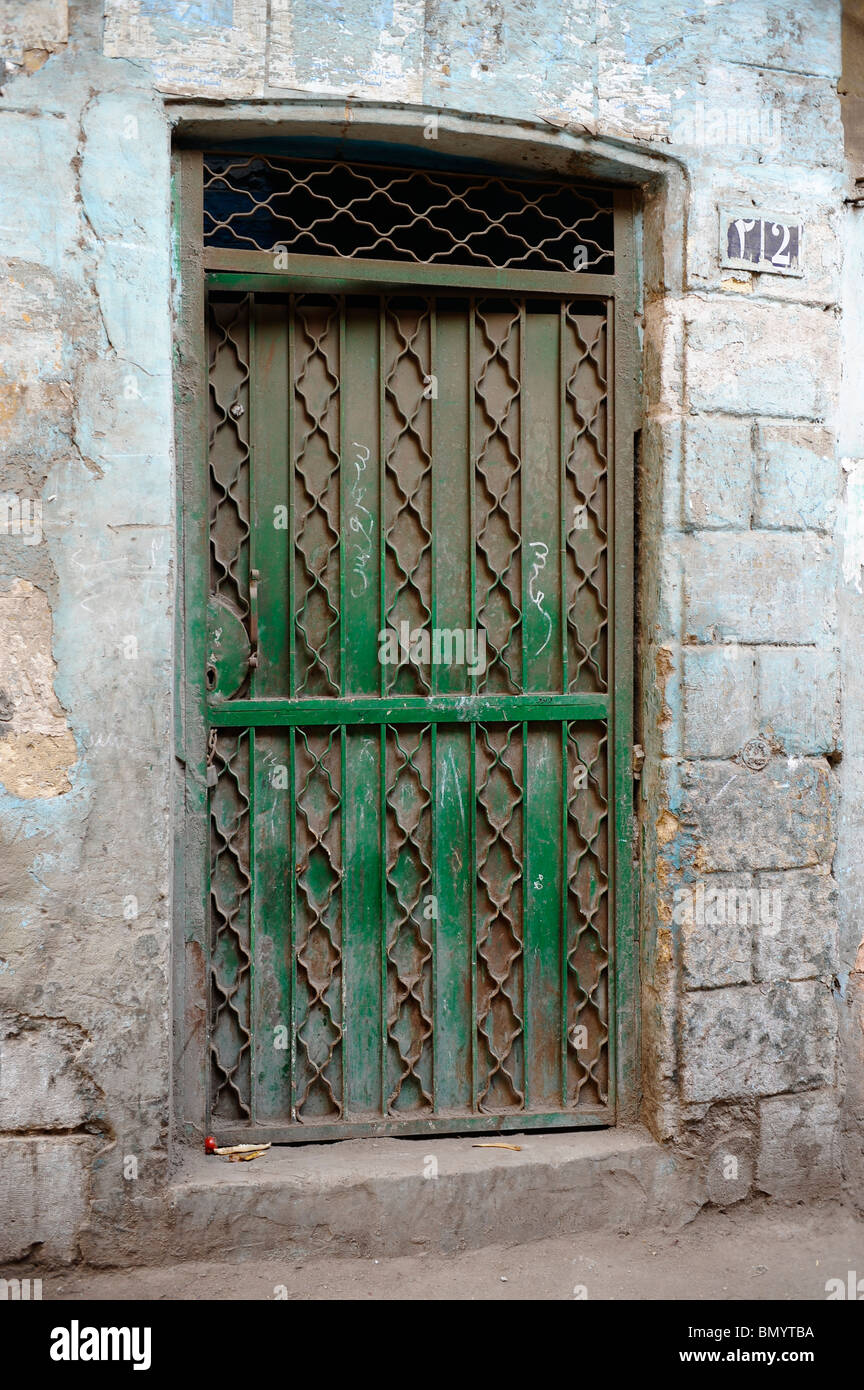 heavy metal door with green paint on an old building in islamic cairo, cairo , egypt Stock Photo