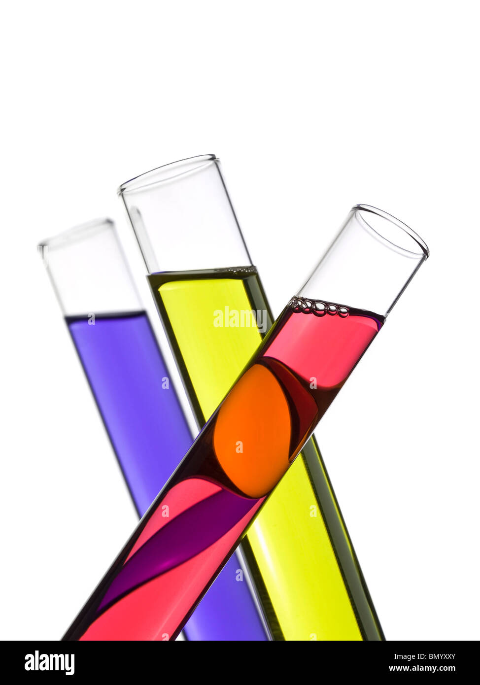 Three test tubes filled with colored liquids. Isolated on white. Stock Photo