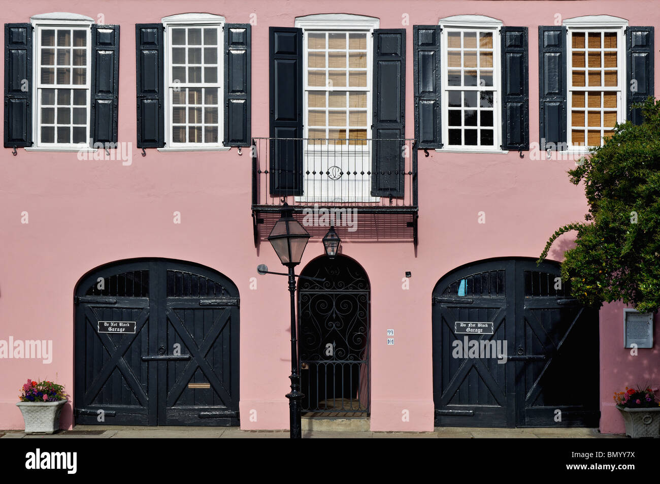 Facade of Pink Home on East Bay Street in Charleston, South Carolina Stock Photo