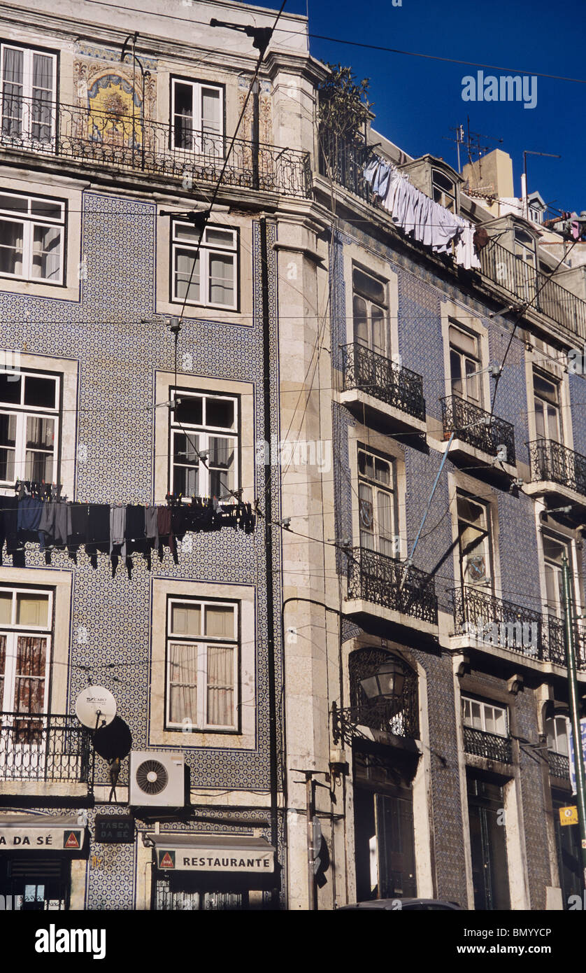 Lisbon housing, apartments above shops, near the city's Cathedral Stock Photo