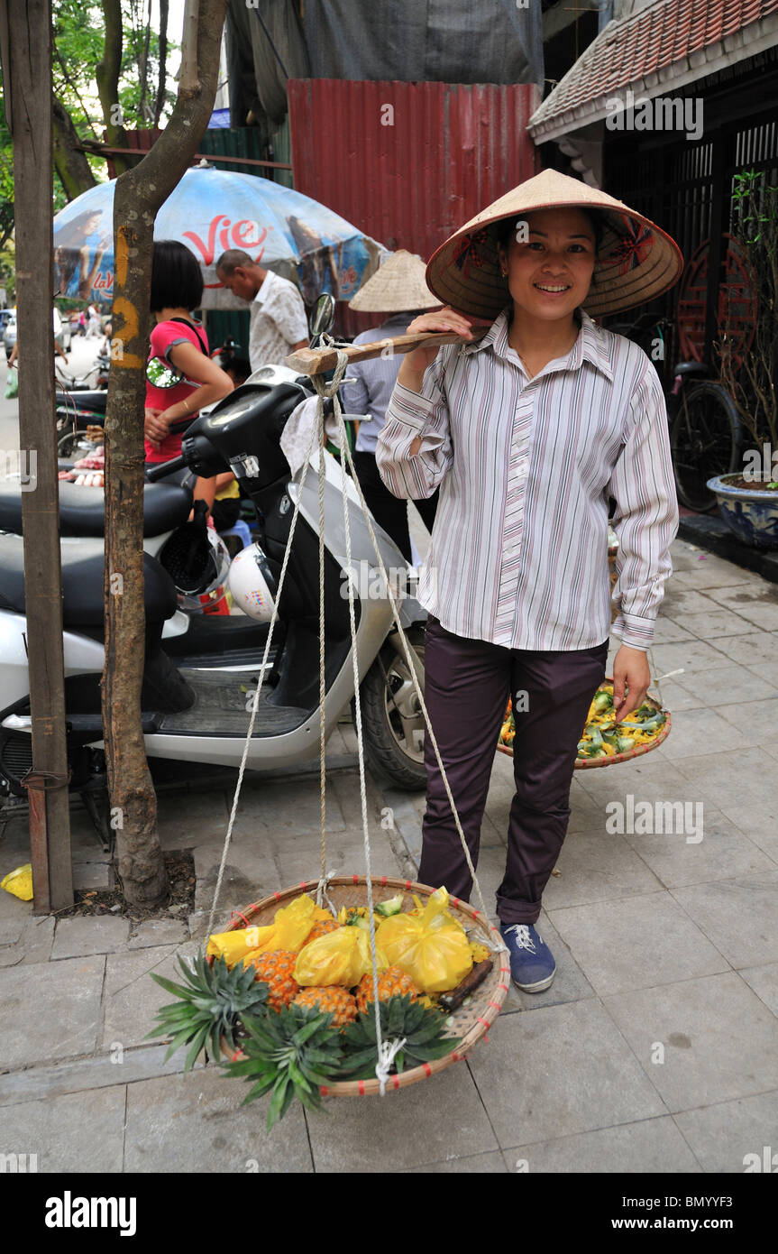 Woman selling Pineapples, Street Trader, Old Quarter, Hanoi, Vietnam Stock Photo