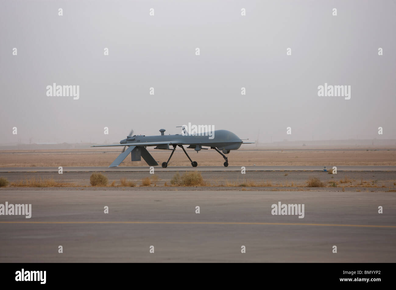 A MQ-1C Warrior taxis out to the runway to for a mission over northern Iraq. Stock Photo
