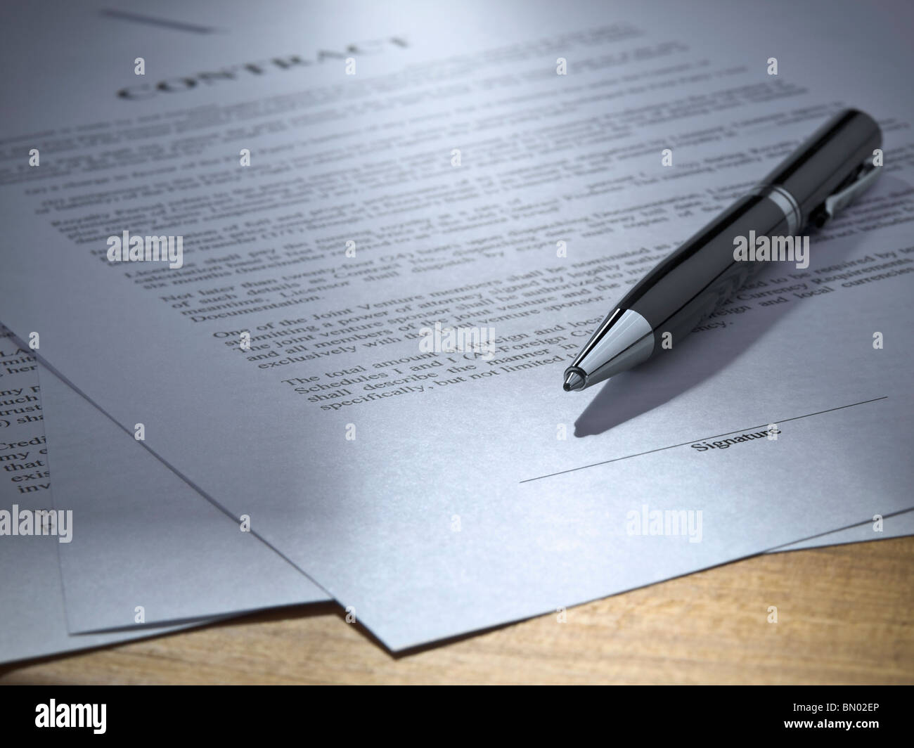 Close up of a pen over a contract to be signed. Stock Photo
