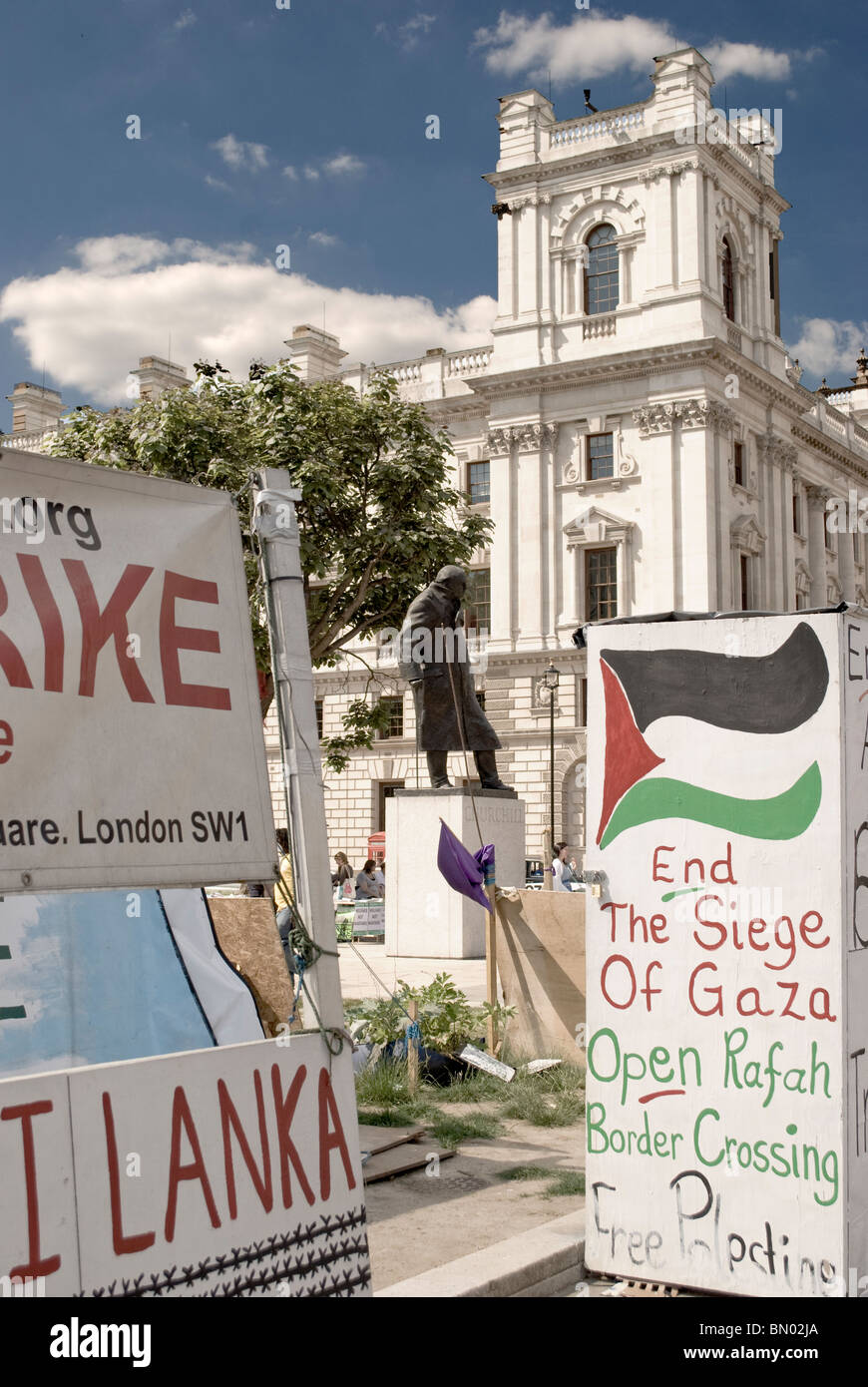 Peace camp (Democracy Village) in Parliament square with Churchill monument in the background. June 2010 Stock Photo