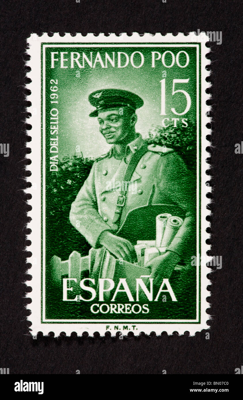 Postage stamp from Fernando Po depicting a mailman. Stock Photo
