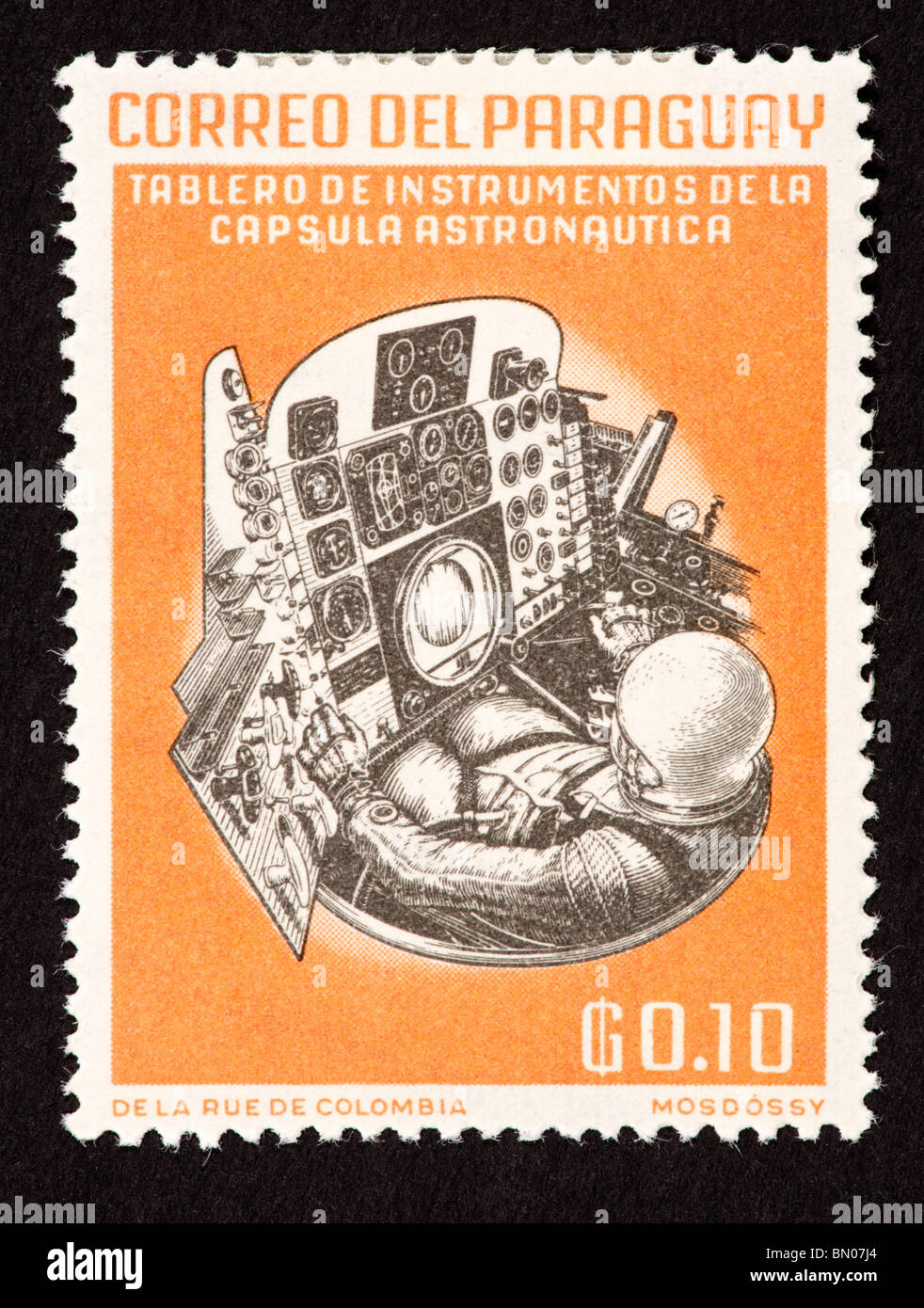Postage stamp from Paraguay depicting the control panel of a spacecraft and Walter Schirra Stock Photo