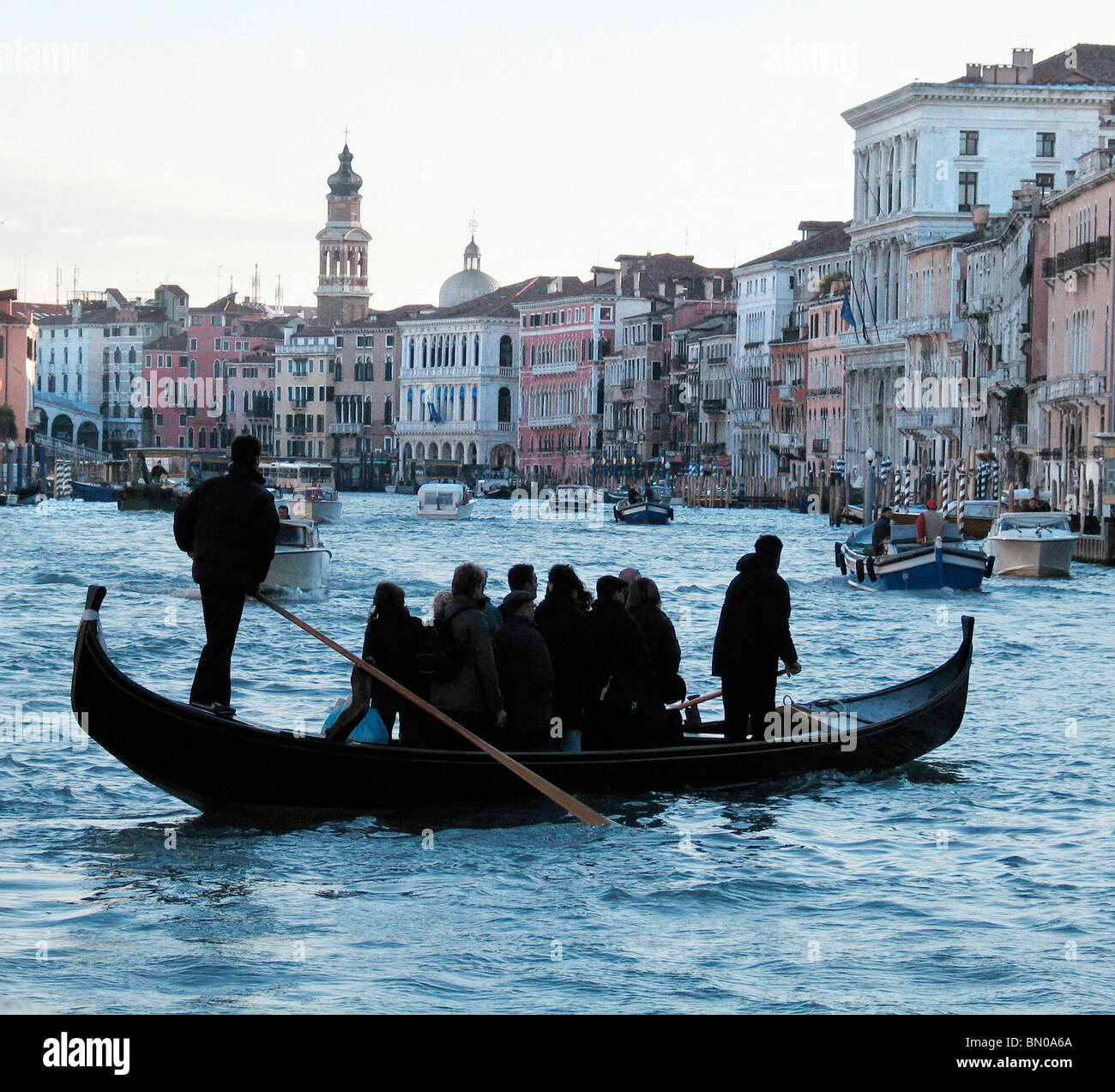 Gondola on the Grand Canal in Venice, Italy at dusk in winter Stock Photo