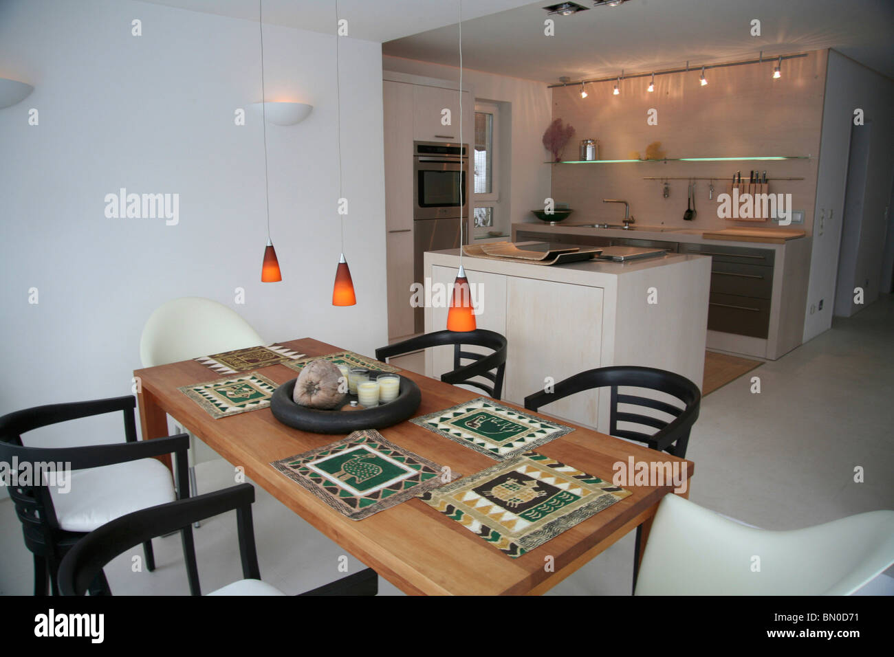 Dining Room with Dining Table, Kitchen in Background Stock Photo - Alamy
