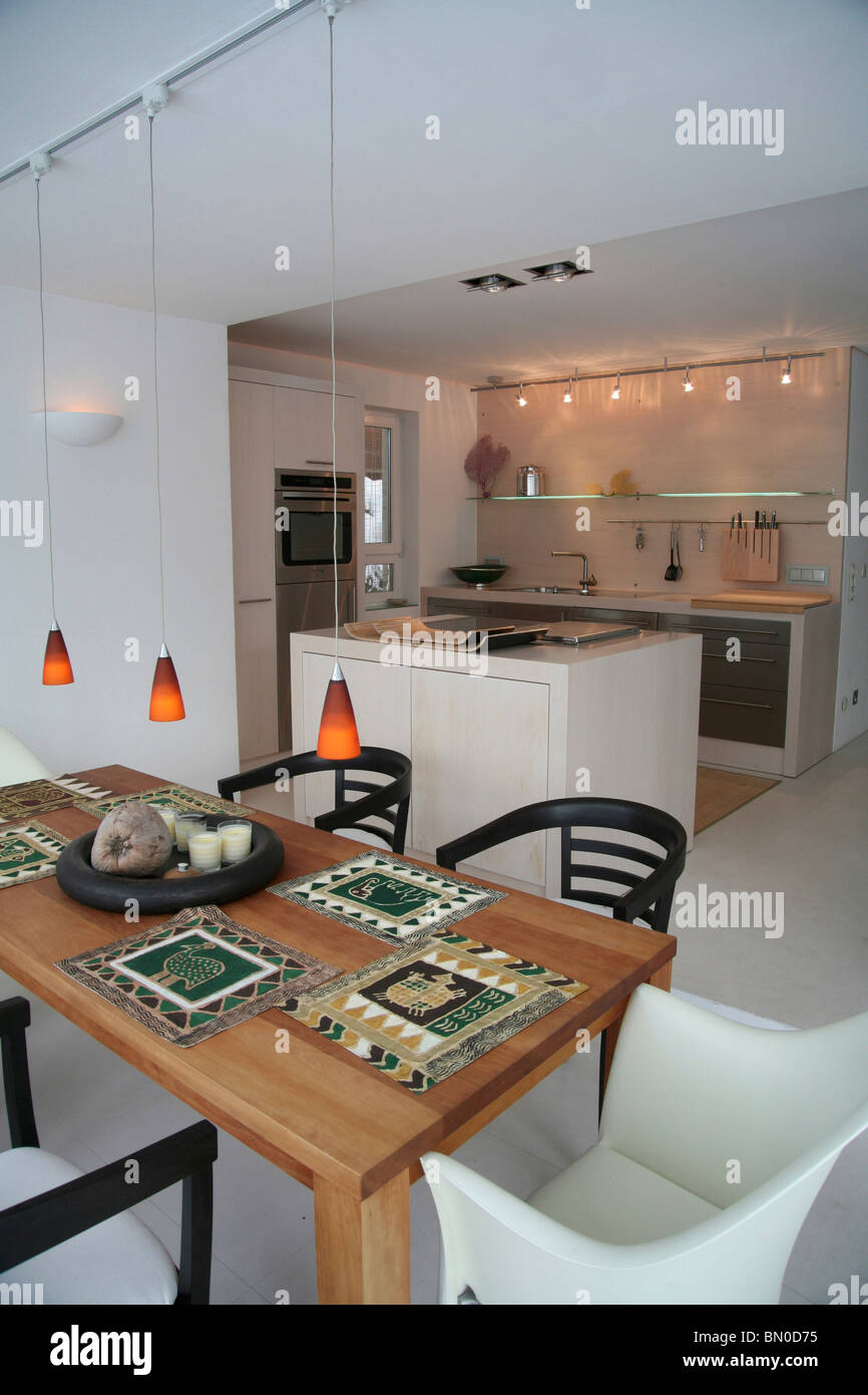 Dining Room with Dining Table, Kitchen in Background Stock Photo - Alamy