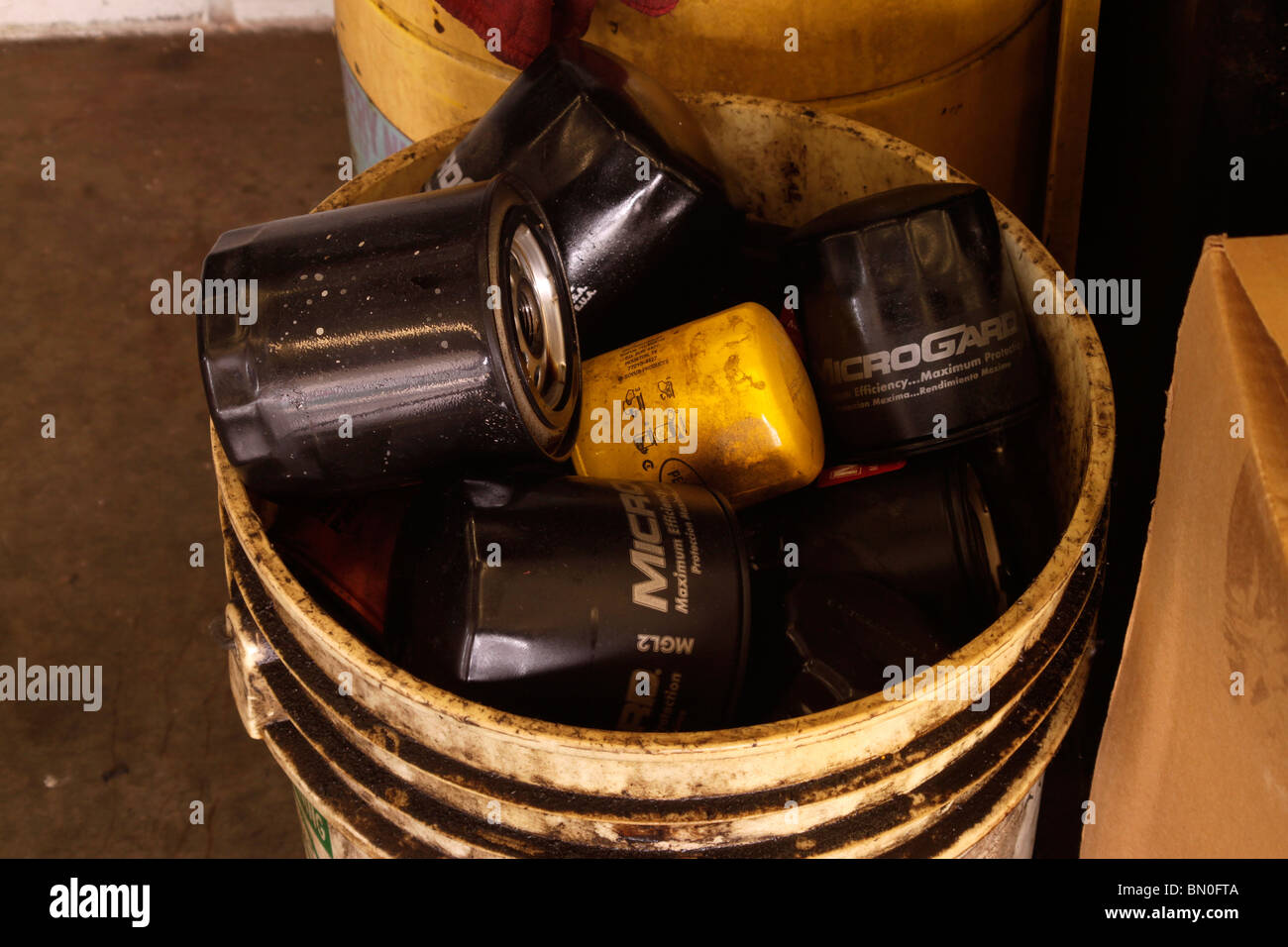 Used engine oil filters waiting disposal and recycling Stock Photo Alamy