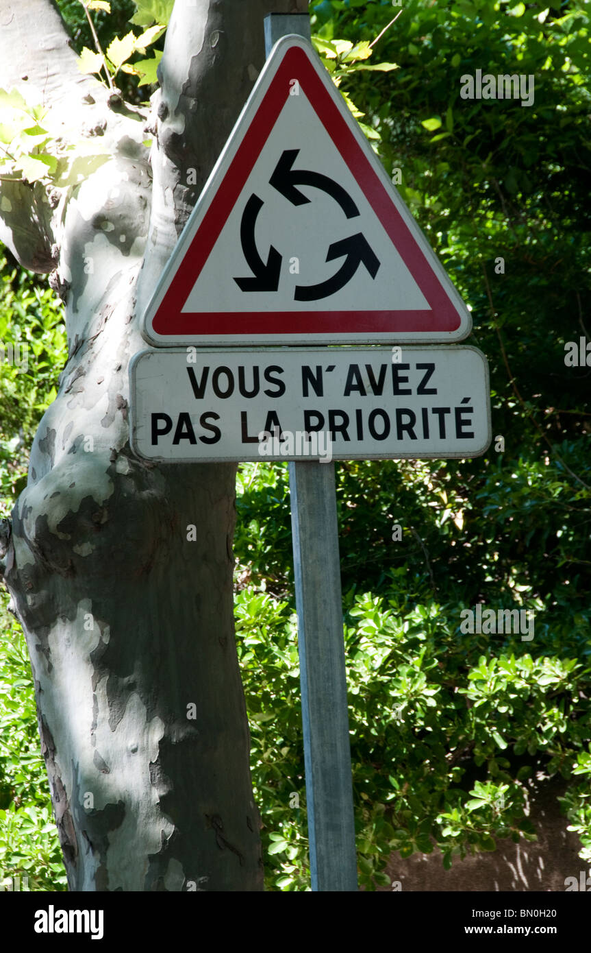 A French road sign warning that you do not have priority at a roundabout. Stock Photo