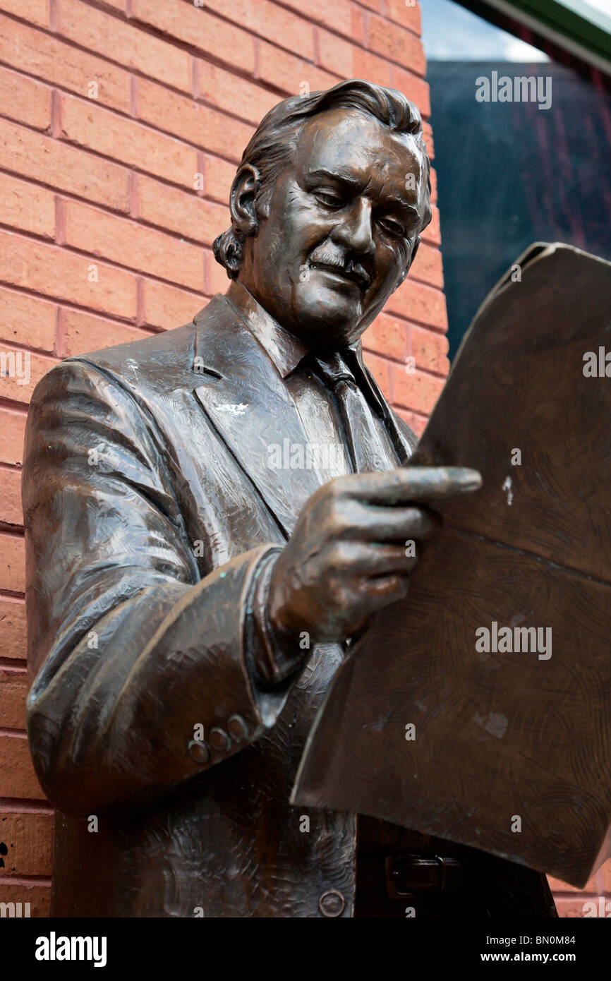 Ybor City, Tampa, FL - July 2009 - Statue of man reading newspaper at Centro Ybor in downtown Ybor City area of Tampa, Florida Stock Photo