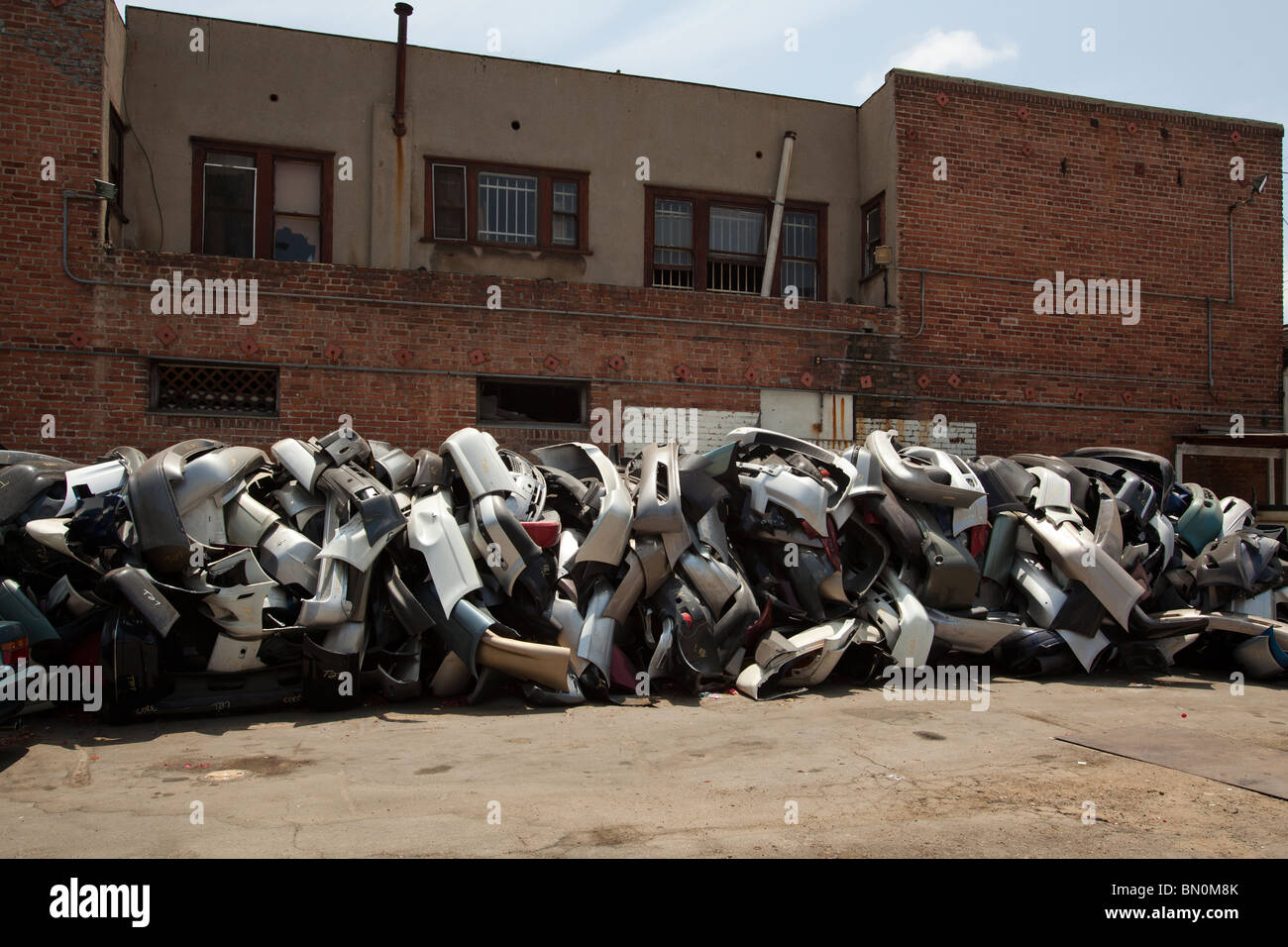 Car fenders piled up at a plating shop. Los Angeles, California, United States of America Stock Photo