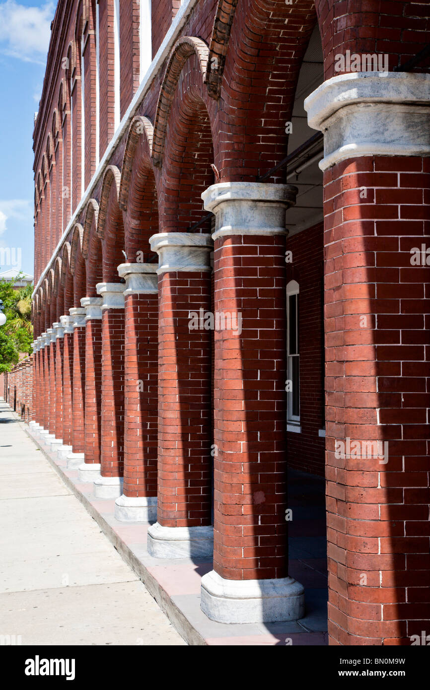 Ybor City, Tampa, FL - July 2009 - Columns and arches form portico on red brick building in Ybor City area of Tampa, Florida Stock Photo