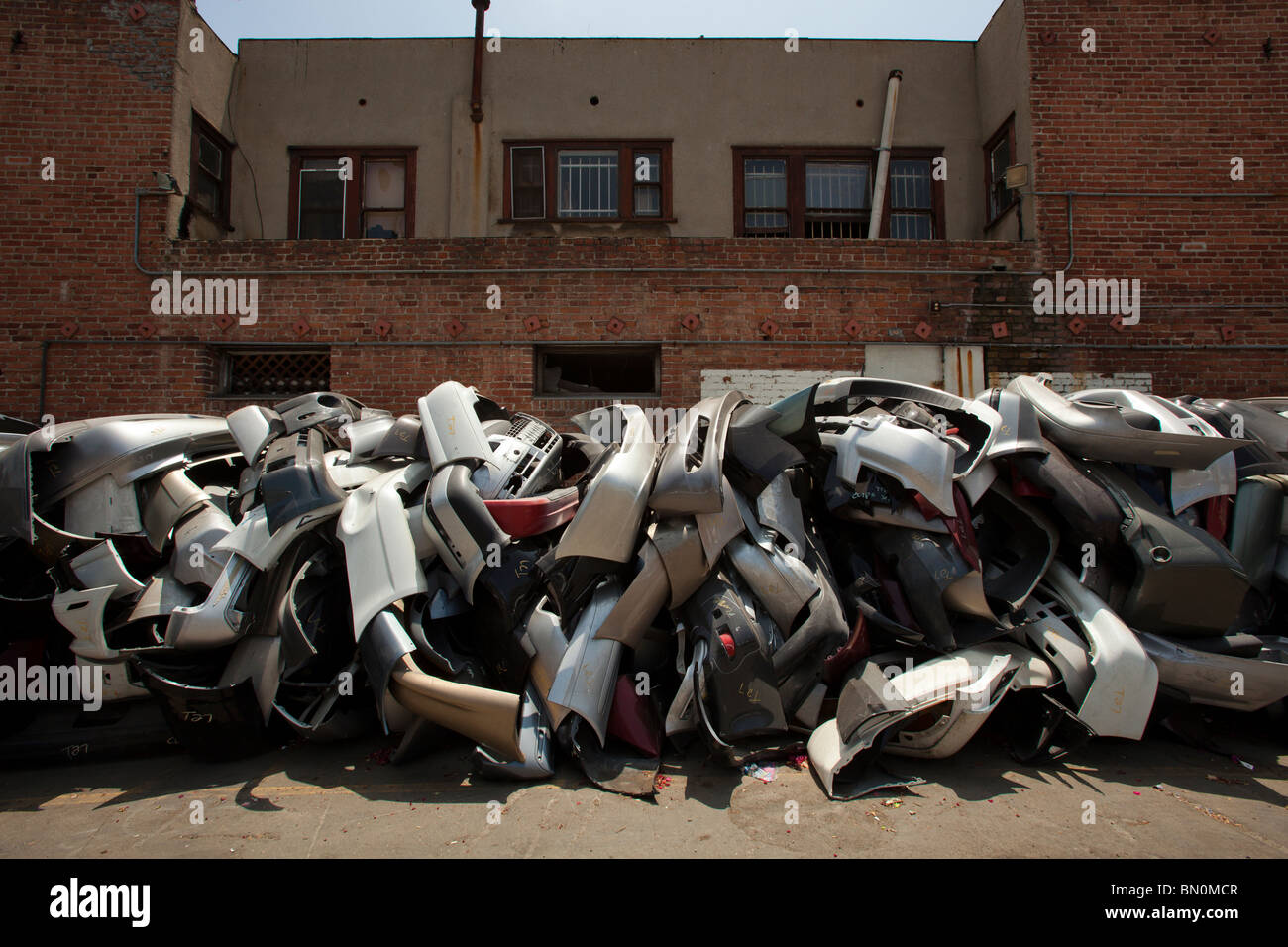 Car fenders piled up at a plating shop. Los Angeles, California, United States of America Stock Photo