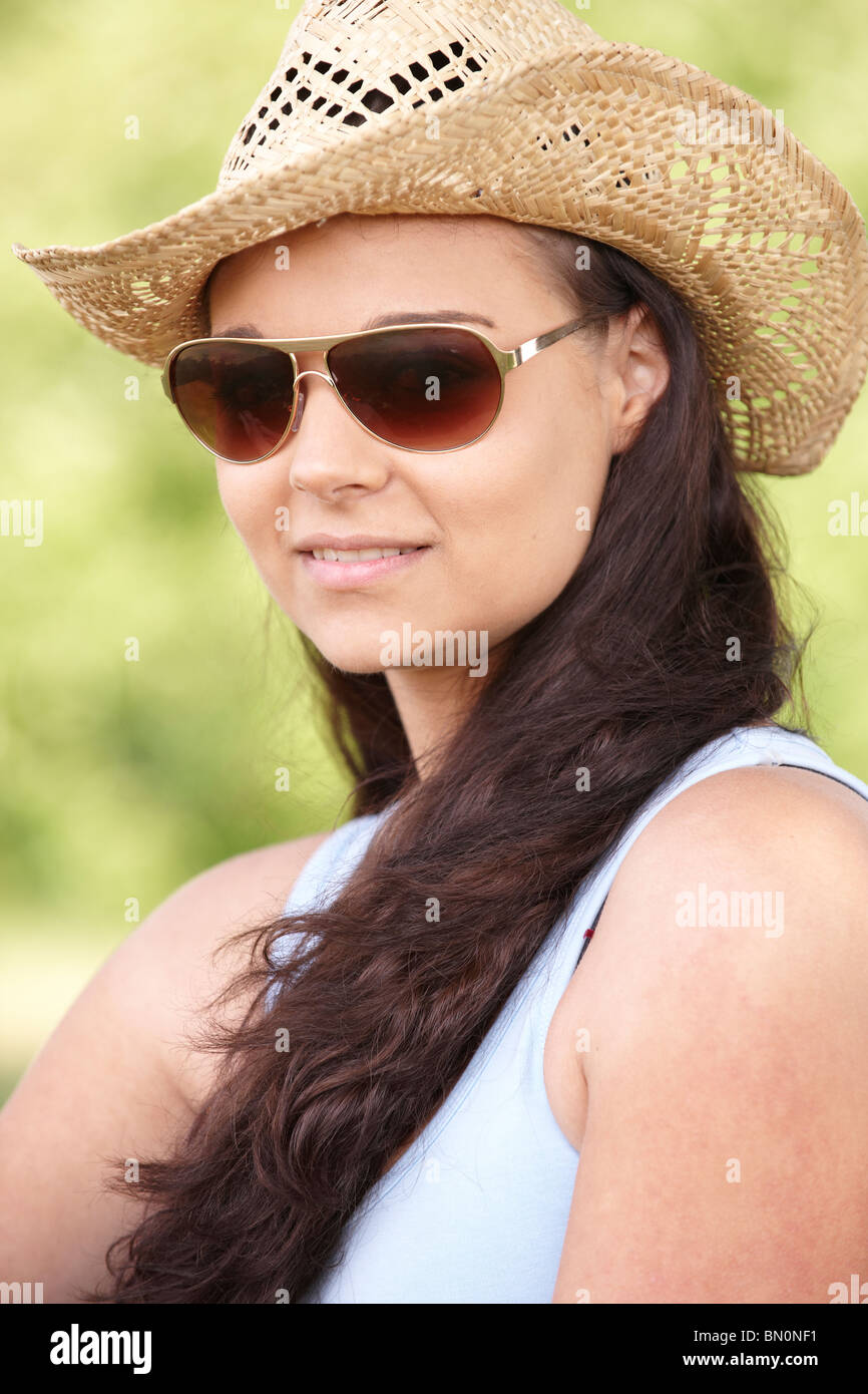 young woman sitting on grass in park enjoying the sunshine Stock Photo ...