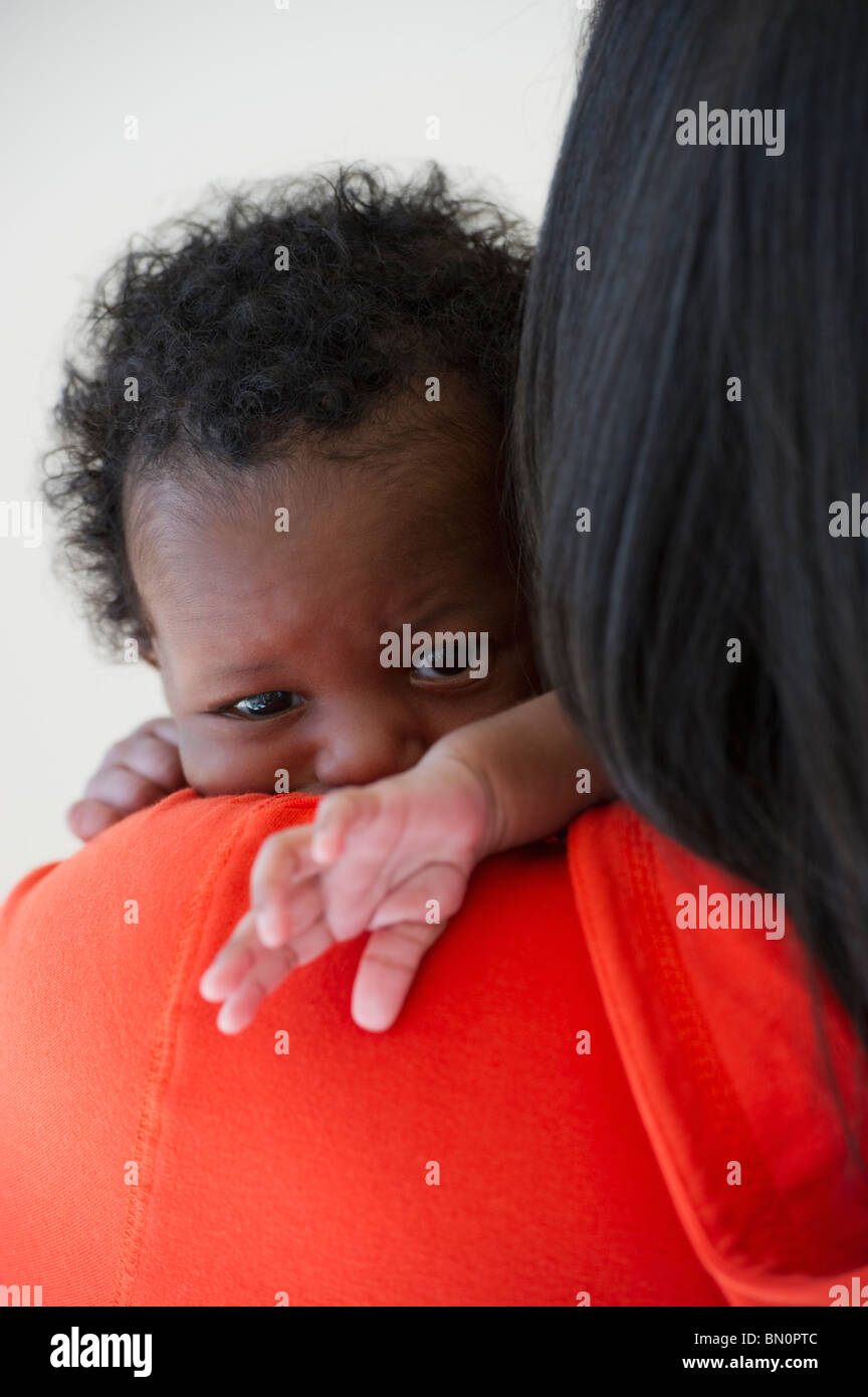 Black mother holding newborn baby Stock Photo
