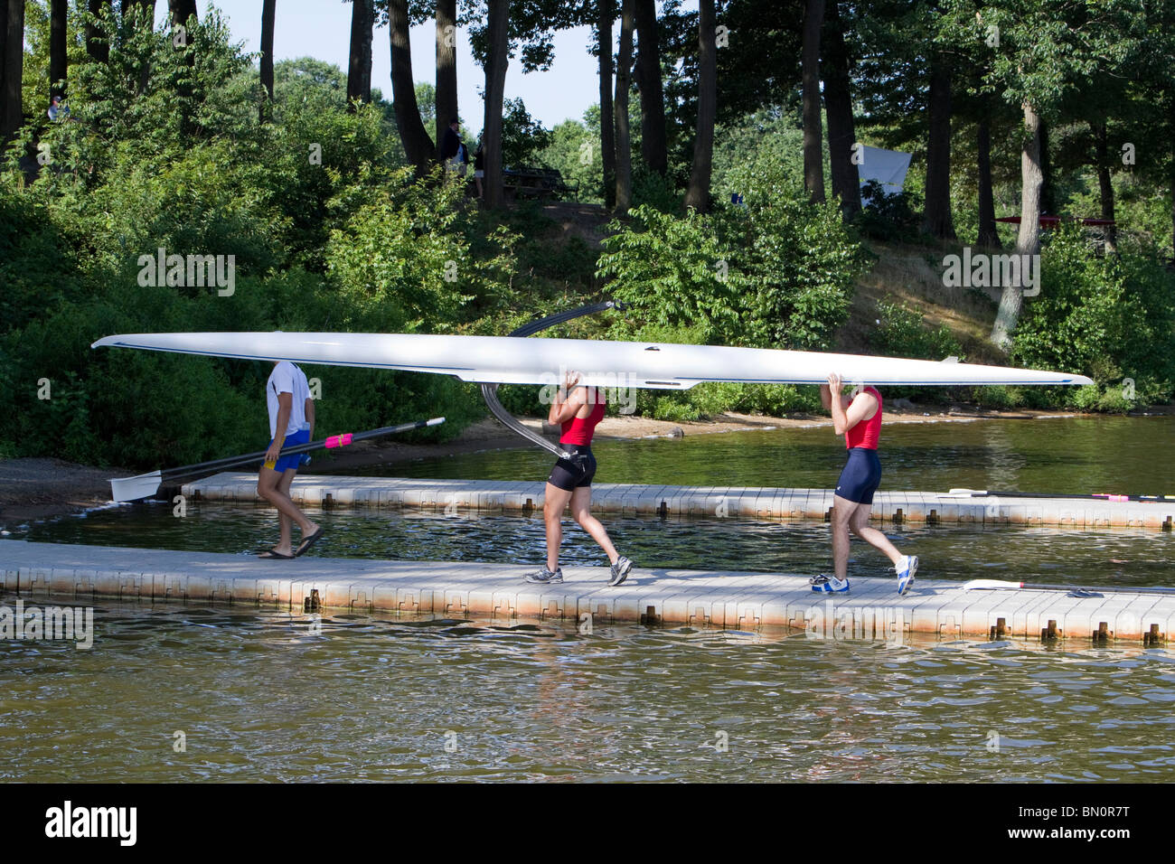At the dock at the United States National Championship Regatta rowing. Taking out and carrying the boats. Stock Photo