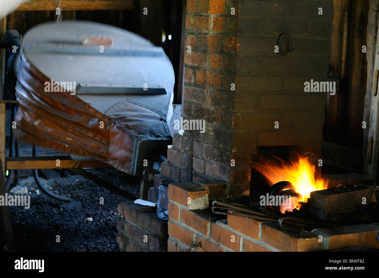 Historic Blacksmith shop bellows and forge furnace at Lang Pioneer Village Keene Ontario Stock Photo