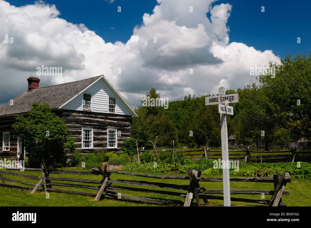 Lang Pioneer Village museum log cabin on Hope street with buck and rail