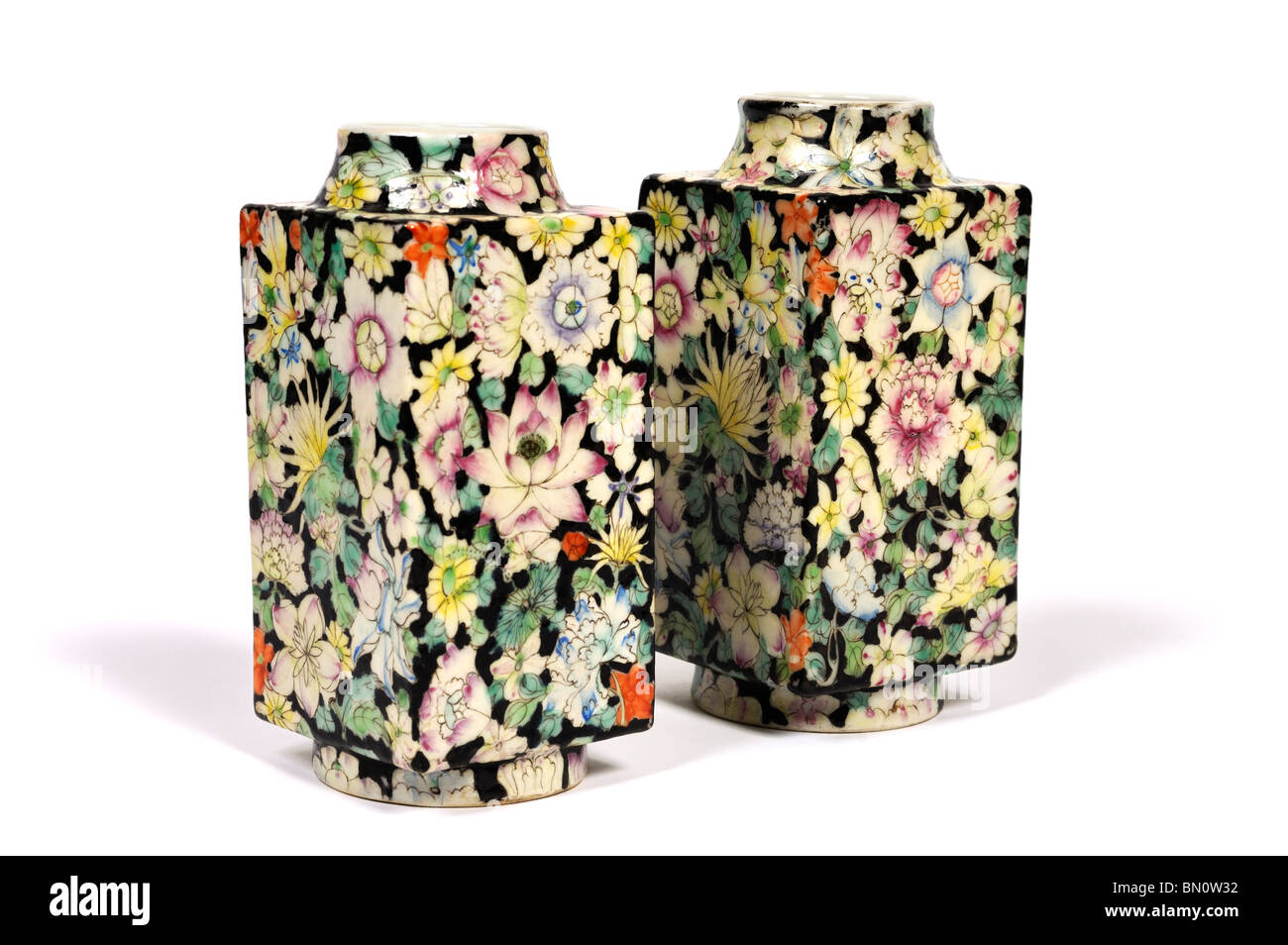 Two Chinese porcelain cong shaped vases decorated with flowers Stock Photo