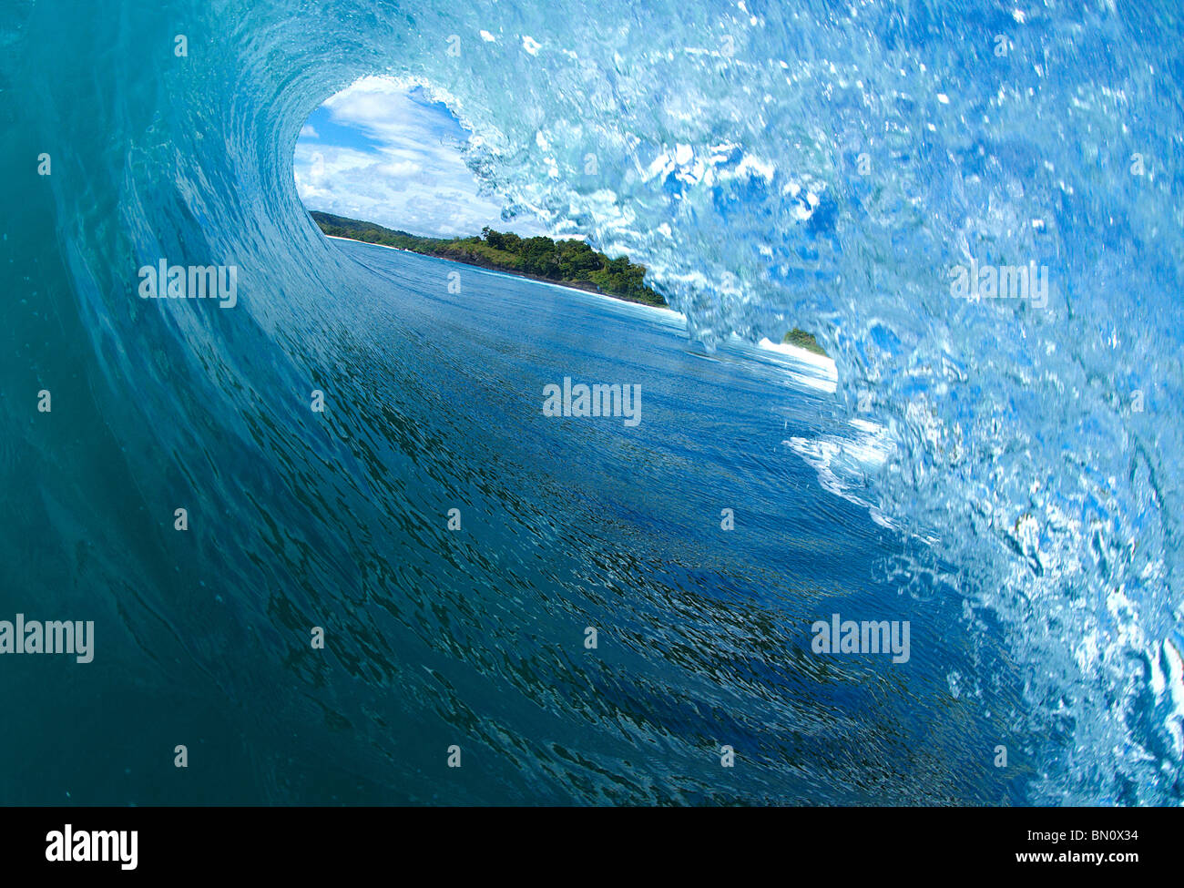 In the tube of a wave Stock Photo