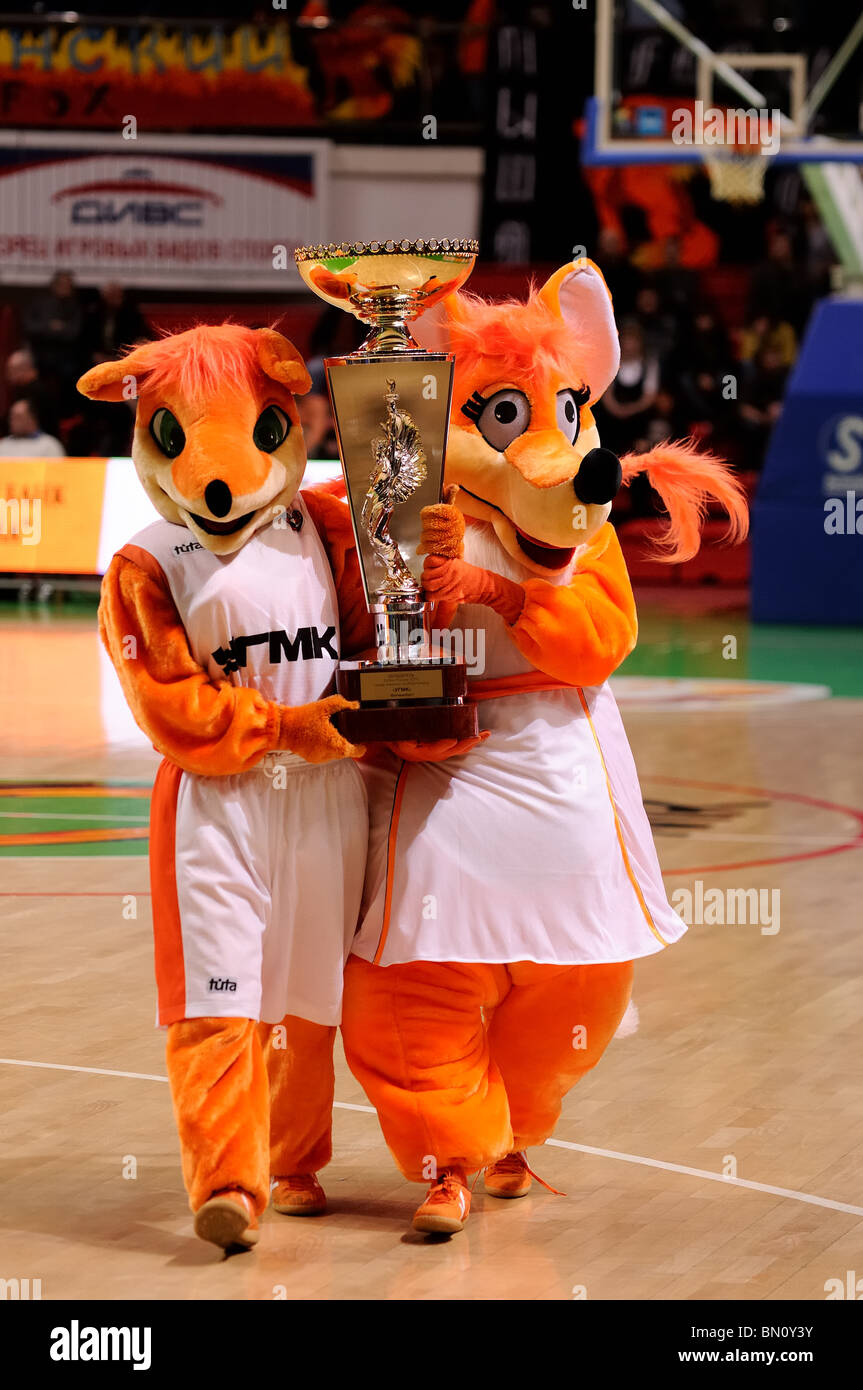 Foxes, symbols of UMMC Ekaterinburg, bring and show to fans the Cup of Russia 2010. UMMC won the trophy on January 21, 2010 Stock Photo