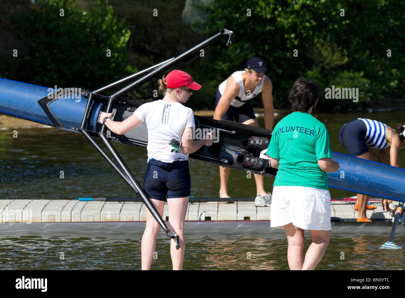At the dock at the United States National Championship Regatta rowing. Taking out and carrying the boats. Stock Photo