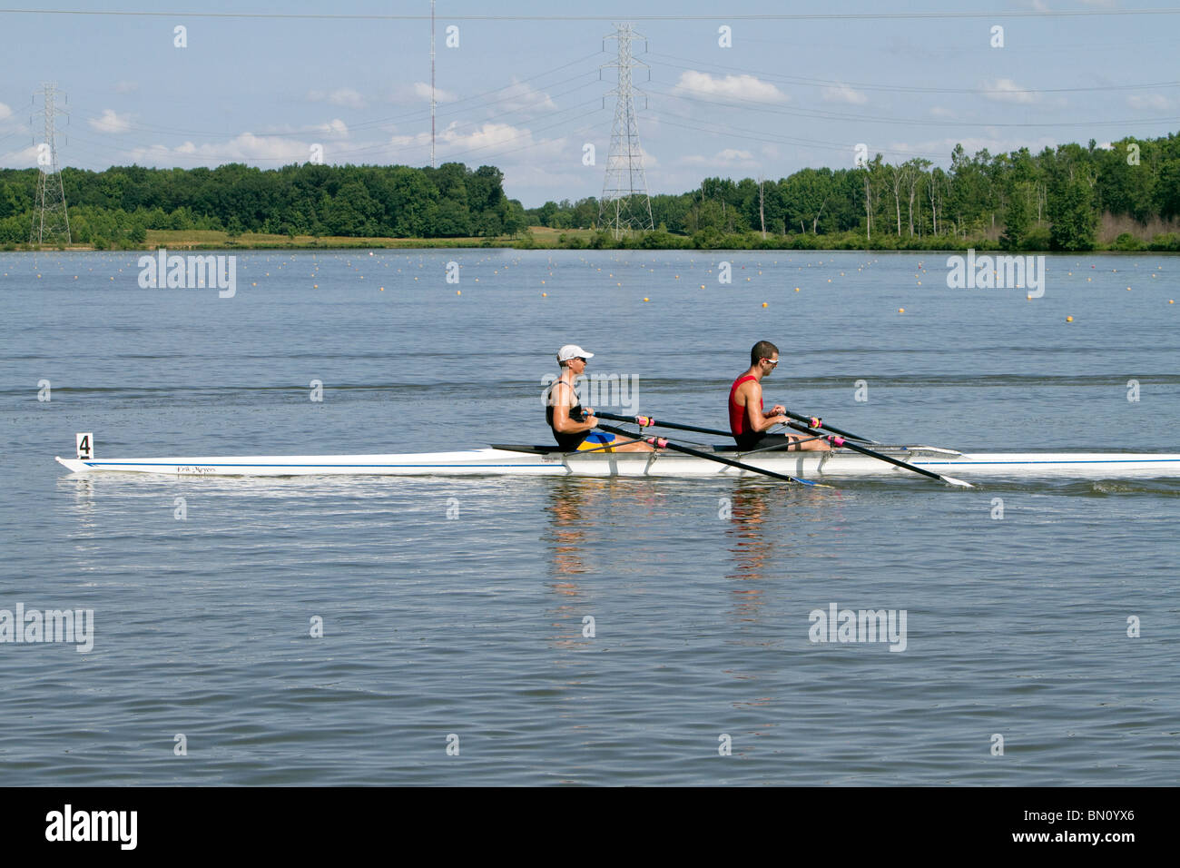 Two man racing shell boat with crew rowing Stock Photo